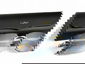 Cartier French Designer Eyeglass Sunglass Frames: Pair of Cartier France luxury designer rimless eyewear featuring gold-tone hardware and wood-grain temples. The frames are signed Cartier and include a black Cartier hard case with a gold logo. Glasse