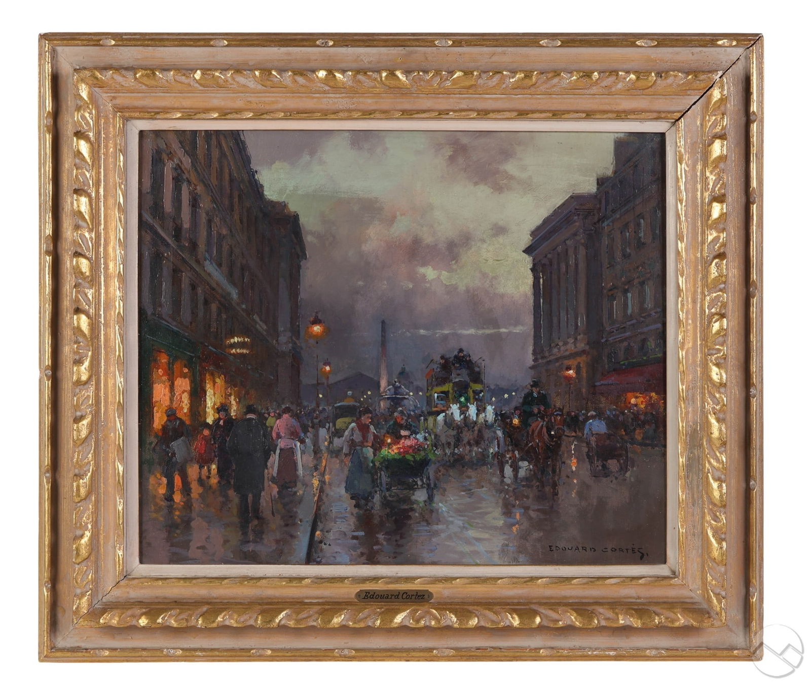 Edouard Cortes 1882-1969 Cityscape Oil Painting: Edouard Cortes (French, 1882-1969), oil on canvas depicting a bustling Paris boulevard filled with figures, horse-drawn carriages, and illuminated shop fronts reflected on rain-soaked streets under la