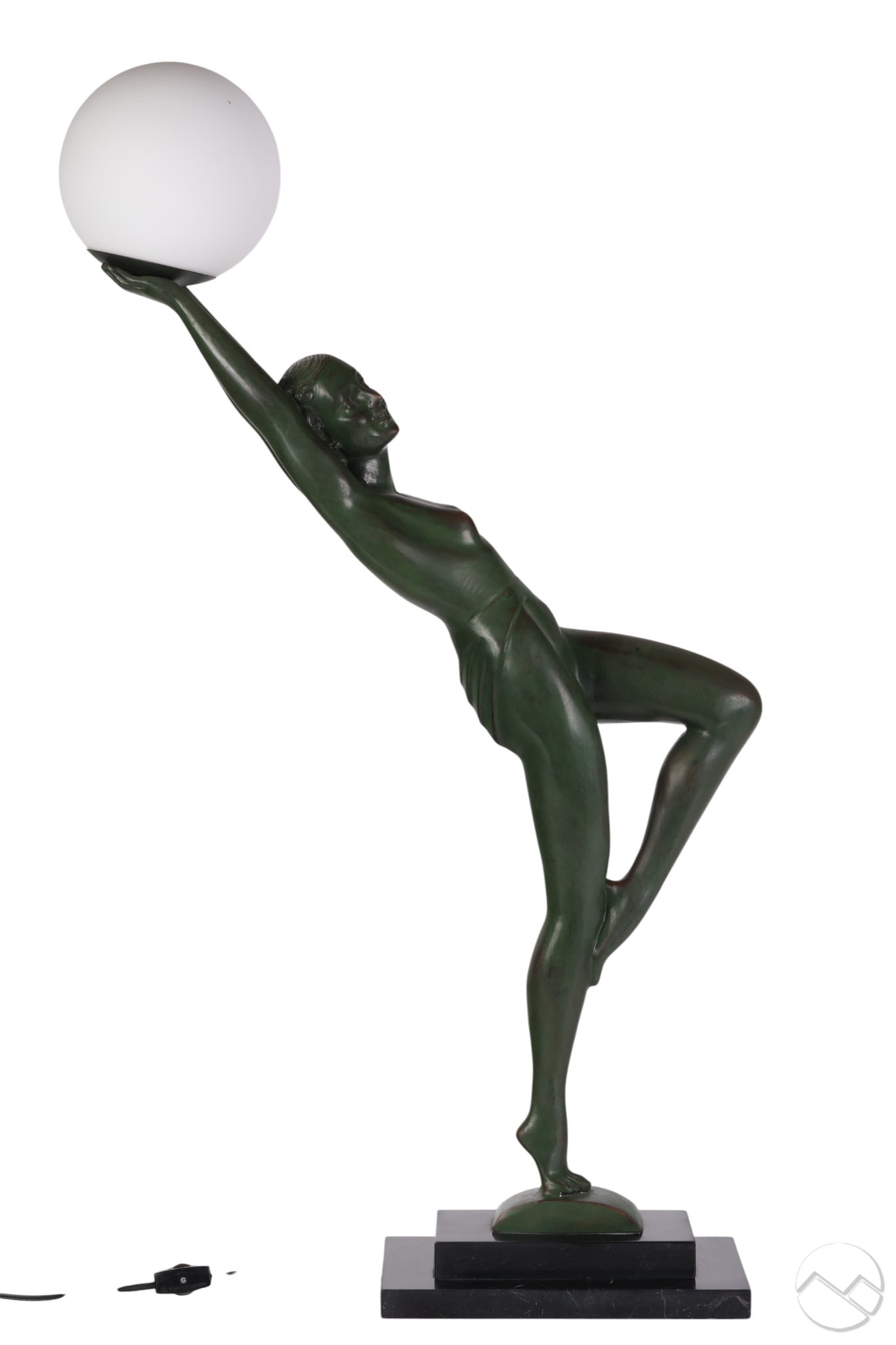 Art Deco Style Green Patinated Female Table Lamp: Art Deco style figural table lamp depicting a stylized semi-nude female dancer in a dynamic pose, holding an opaline glass globe aloft. The figure features a dark green patinated finish and is mounted