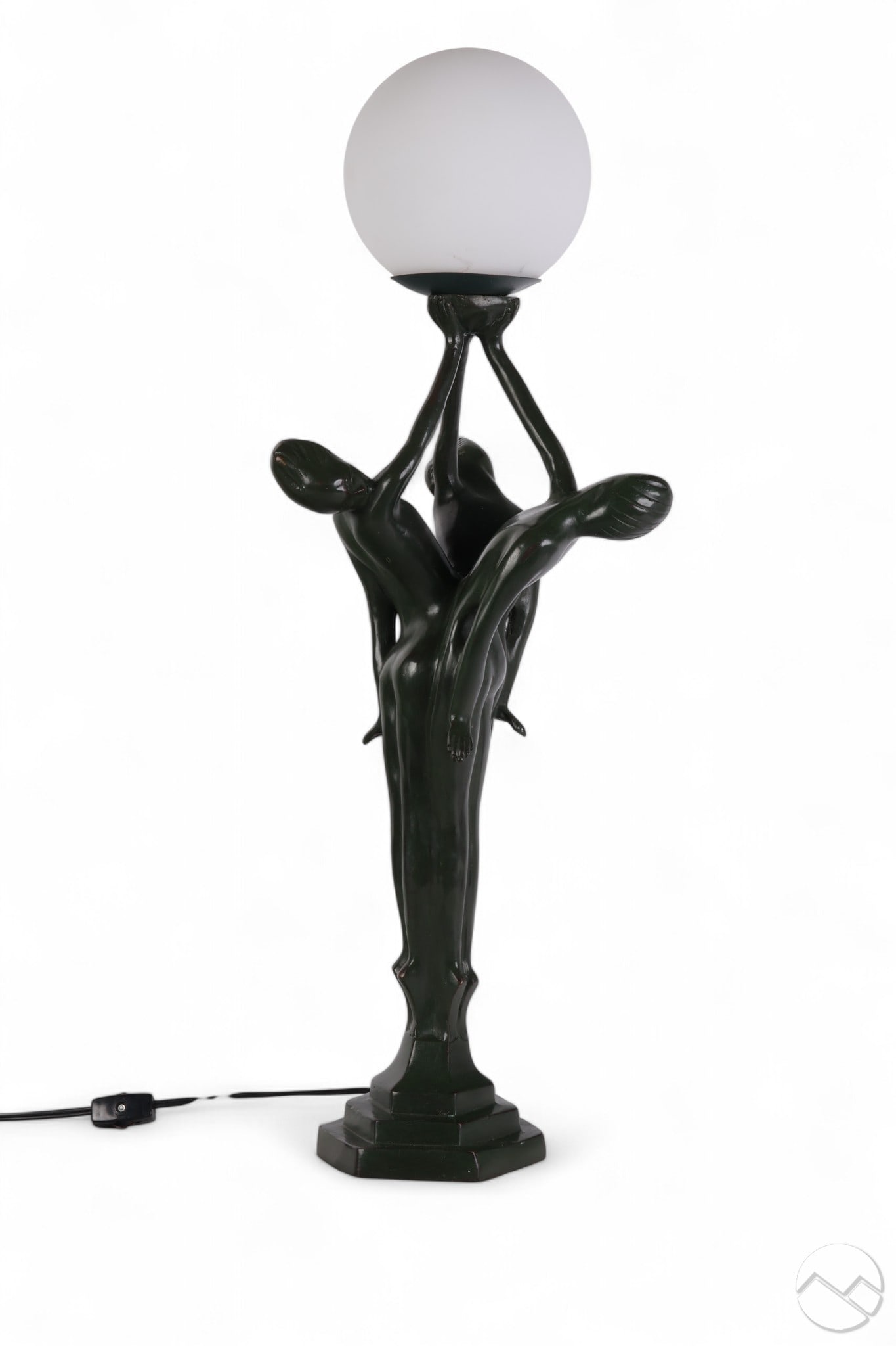 Art Deco Style Green Patinated Female Figural Lamp: Art Deco style bronze figural table lamp featuring three nude female forms in an intertwined vertical pose, their outstretched arms supporting a single opaline glass globe. The figures display a dark 