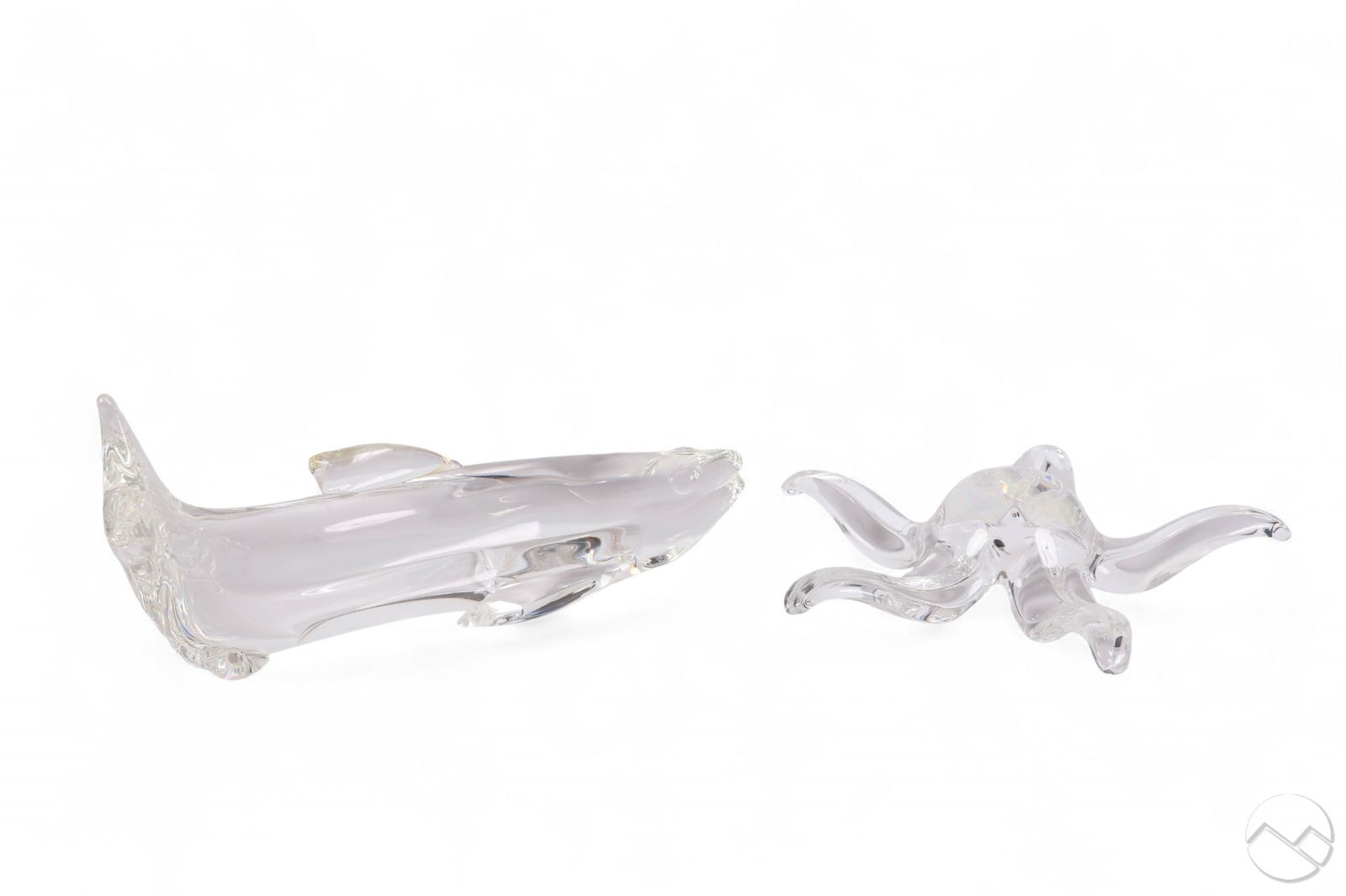 Steuben Crystal Starfish & Salmon Glass Sculptures: Steuben two piece lot of clear crystal art glass sculptures. The starfish is executed with flowing arms and fluid form, the salmon rendered with elongated body and stylized fins. Measurements range in