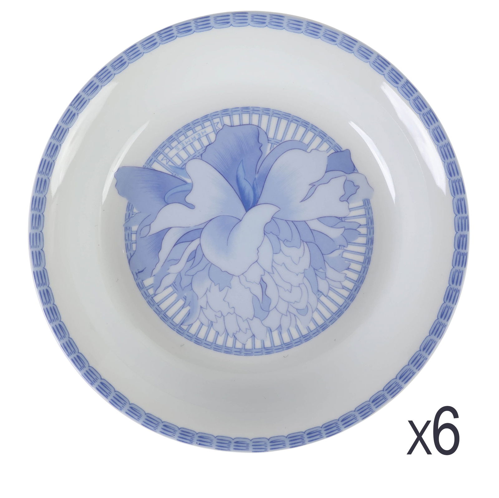 Hermes Porcelain Les Pivoines Blue Soup Bowls SET: Hermes French porcelain set of six rim soup bowls in the Les Pivoines Blue pattern, introduced in 1986. Each bowl features a blue basket weave motif around the border and a central floral leaf petal d