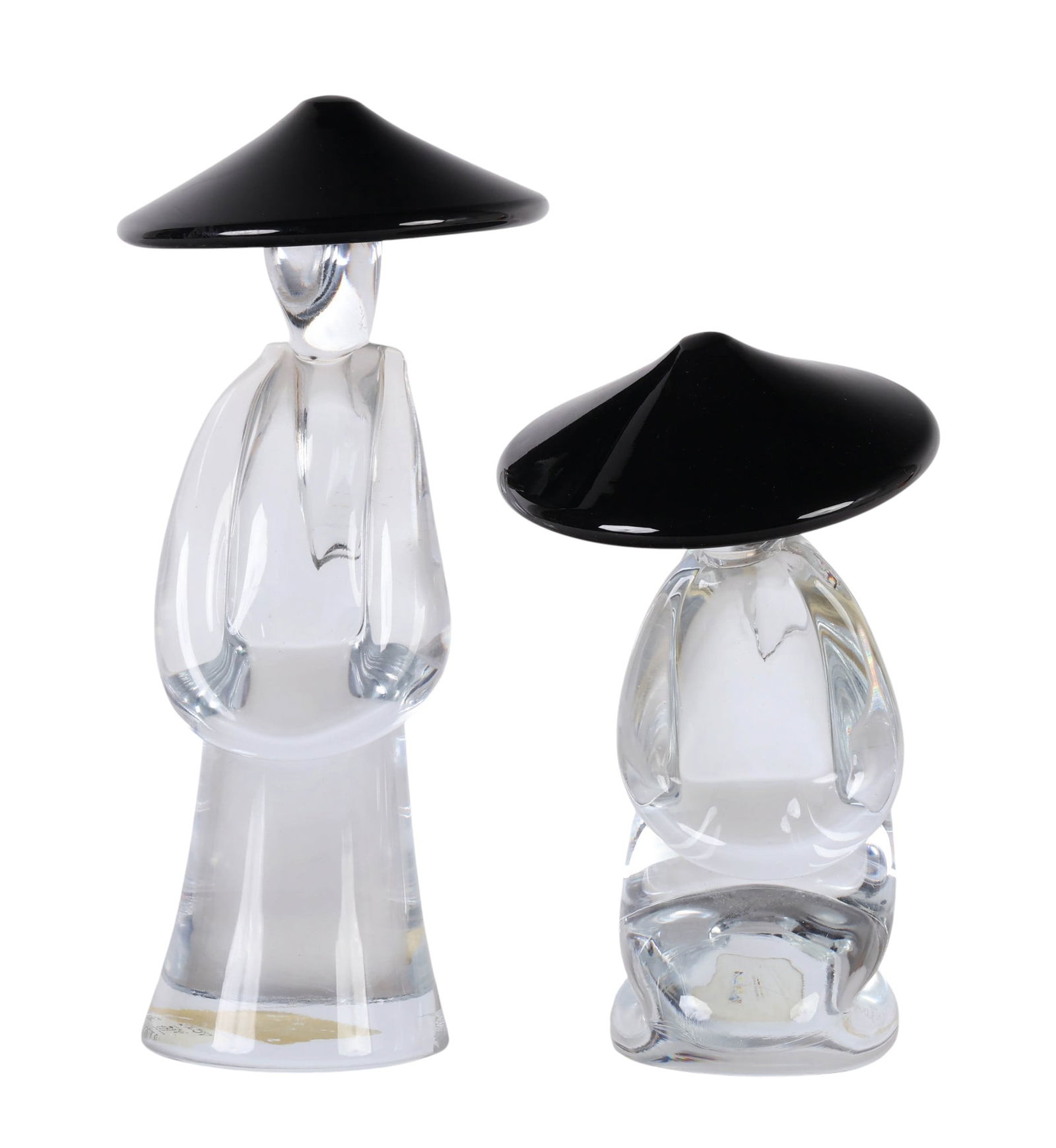 Renato Aantra b.1943 Italian Glass Figurines LOT: Renato Anatra (Italian, born 1943), pair of studio art glass sculptures for Arte '80. Each hand blown figure is rendered in clear glass with stylized human forms featuring pony tails and oversized bla