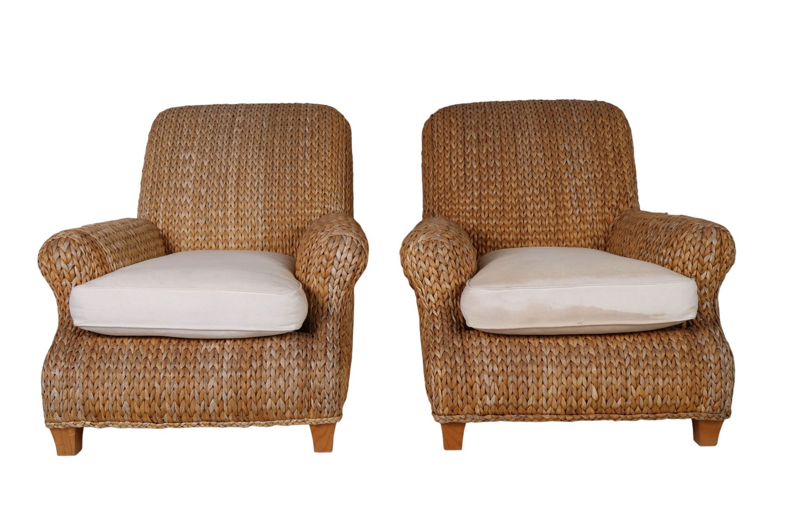 Ralph Lauren PR. Woven Seagrass Hurley Club Chairs: Pair of Ralph Lauren luxury designer coastal style club chairs featuring thick woven rattan frames with curved arms and backs. Each includes a removable white seat cushion with a branded fabric label