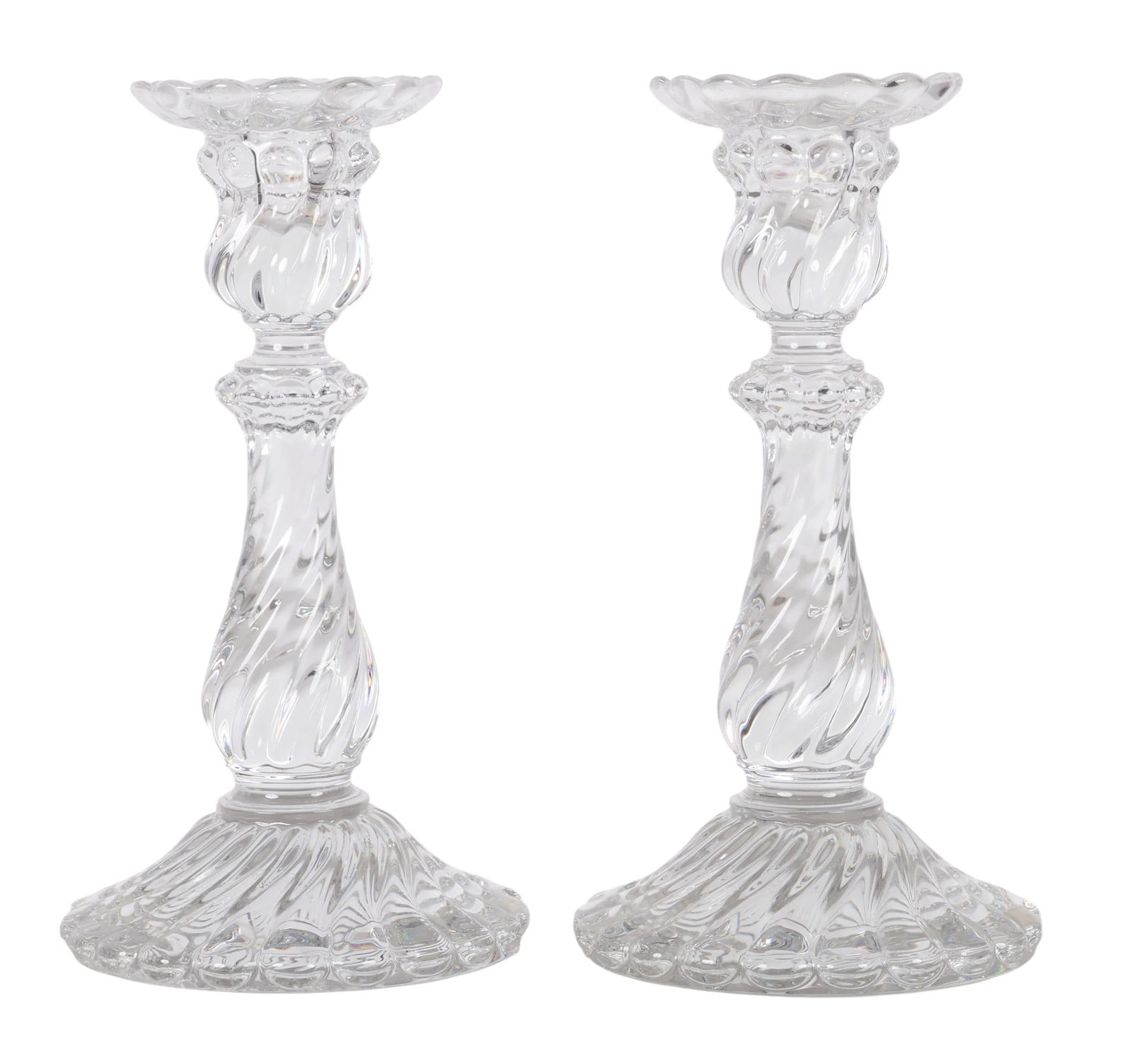 Baccarat Pair of French Crystal Swirl Candlesticks: Pair of Baccarat crystal candlesticks in the classic Bambous Tors design, featuring a clear glass swirl pattern with raised relief details flowing from the base through the stems. Each is marked on th