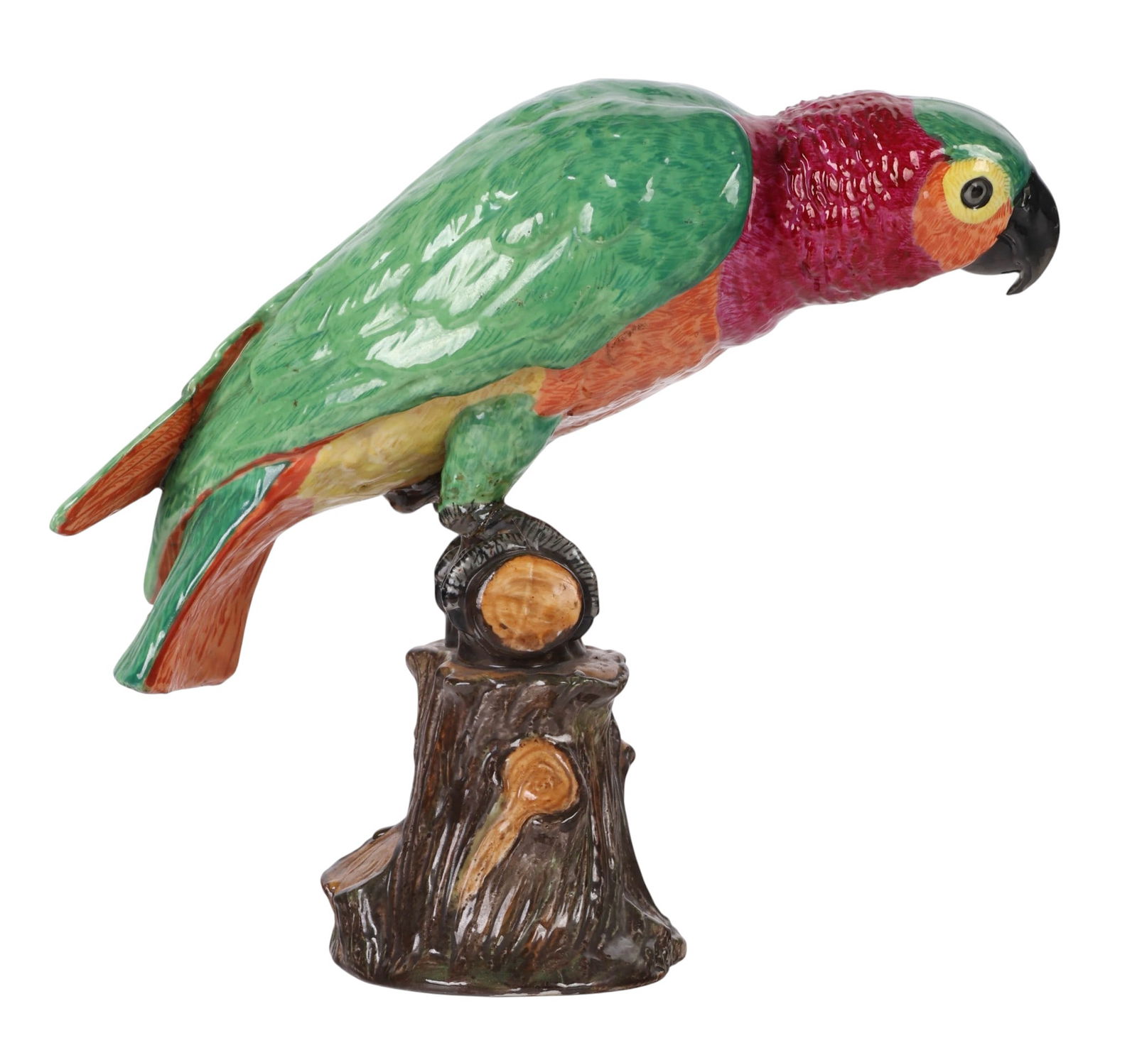 Schierholz Germany Porcelain Parrot Bird Figurine: Schierholz German hand painted porcelain figurine depicting a parrot macaw perched on a naturalistic tree stump base. The parrot features finely modeled plumage in green, pink, orange, and yellow tone