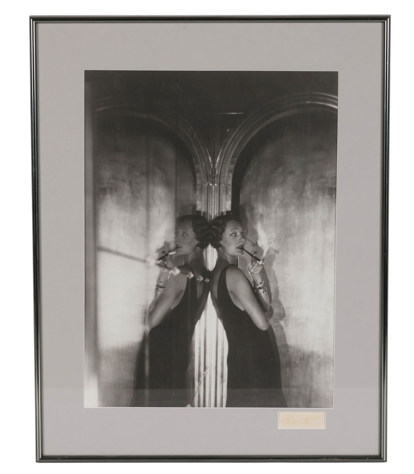 Cecil Beaton 1904-1980 Gertrude Lawrence SIGNED: Cecil Beaton (British, 1904-1980), antique silver gelatin photograph depicting acclaimed actress Gertrude Lawrence, elegantly posed in a mirrored setting., in a sleek black gown with cigarette holder