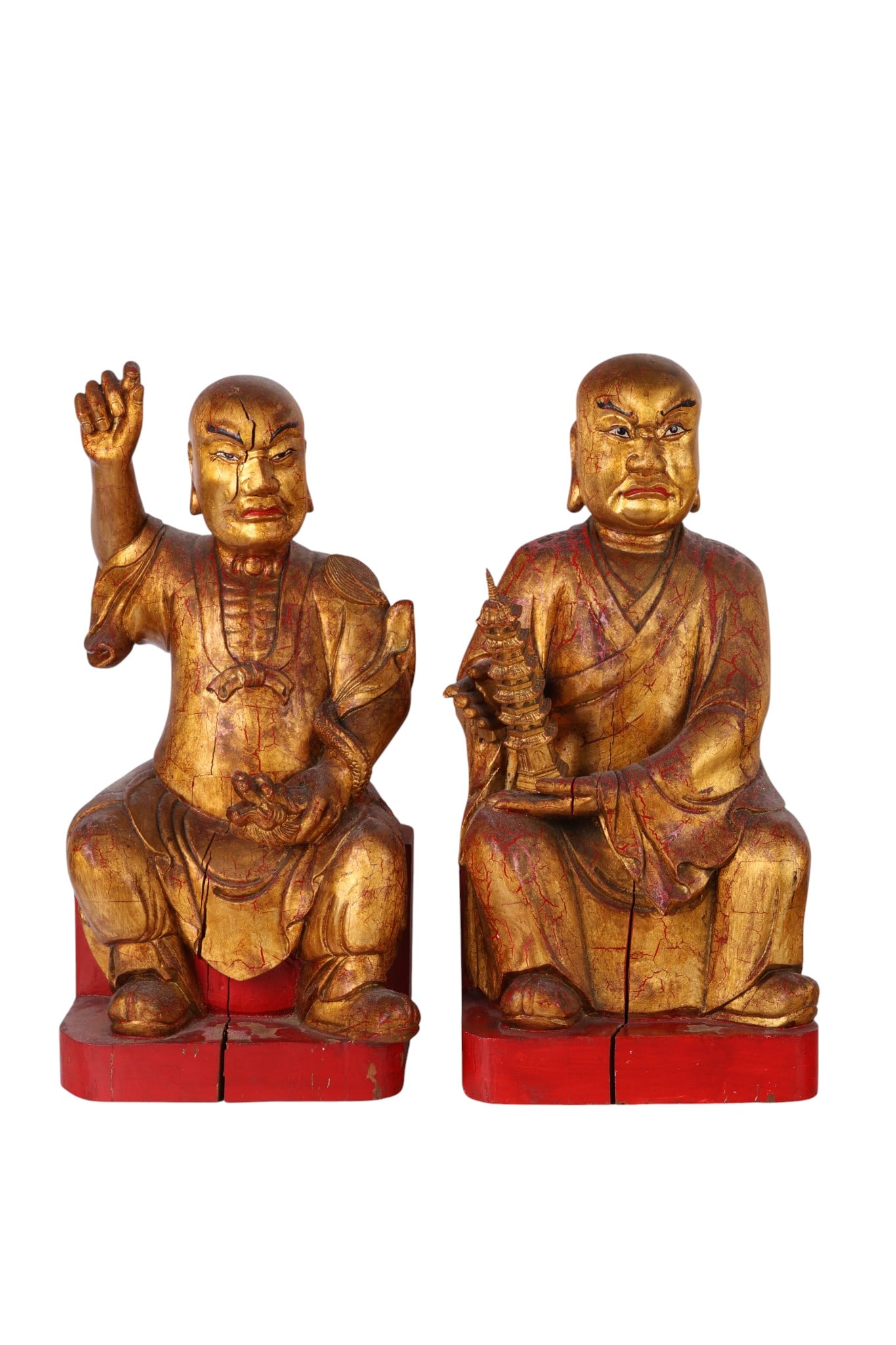 Chinese Pair of Gilt Wood Lohan Buddha Sculptures: Pair of Chinese carved giltwood Buddhist temple figures, depicted in the style of Arhat (Lohan), each seated in traditional monk robes with expressive facial features. One figure raises an arm in gest