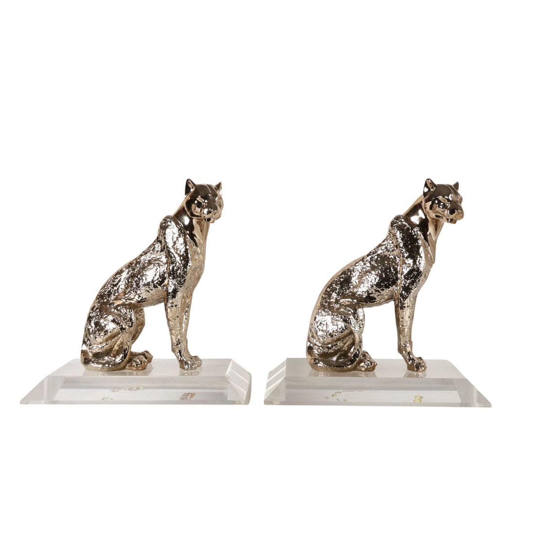 Modernist Pair of 18" Silvered Panthers Sculptures: Pair of contemporary silvered composition panther figures, each modeled in a seated pose with textured surfaces and smooth facial detailing. Mounted on clear beveled lucite display bases that provide