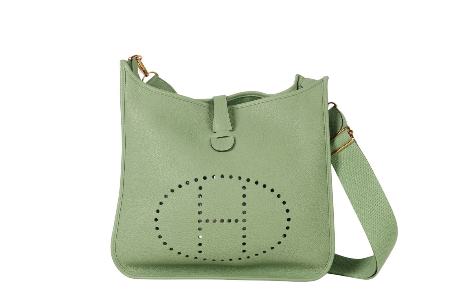 Hermes Green Clemence Leather Evelyne Shoulder Bag: Hermes Evelyne purse crafted in supple green Clemence leather, featuring the iconic perforated "H" logo prominently displayed on the front. Designed with a rear slip pocket, snap tab closure, and line