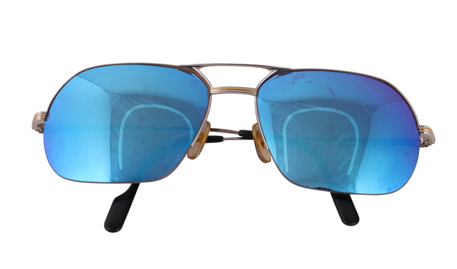 Cartier Luxury Designer Aviator Style Sunglasses: Cartier luxury French designer brand optical aviator eye wear sunglasses with silver metal frame and blue mirrored lenses. Bridge marked 60 17. Inner arms marked Cartier and Made in France. Temple len