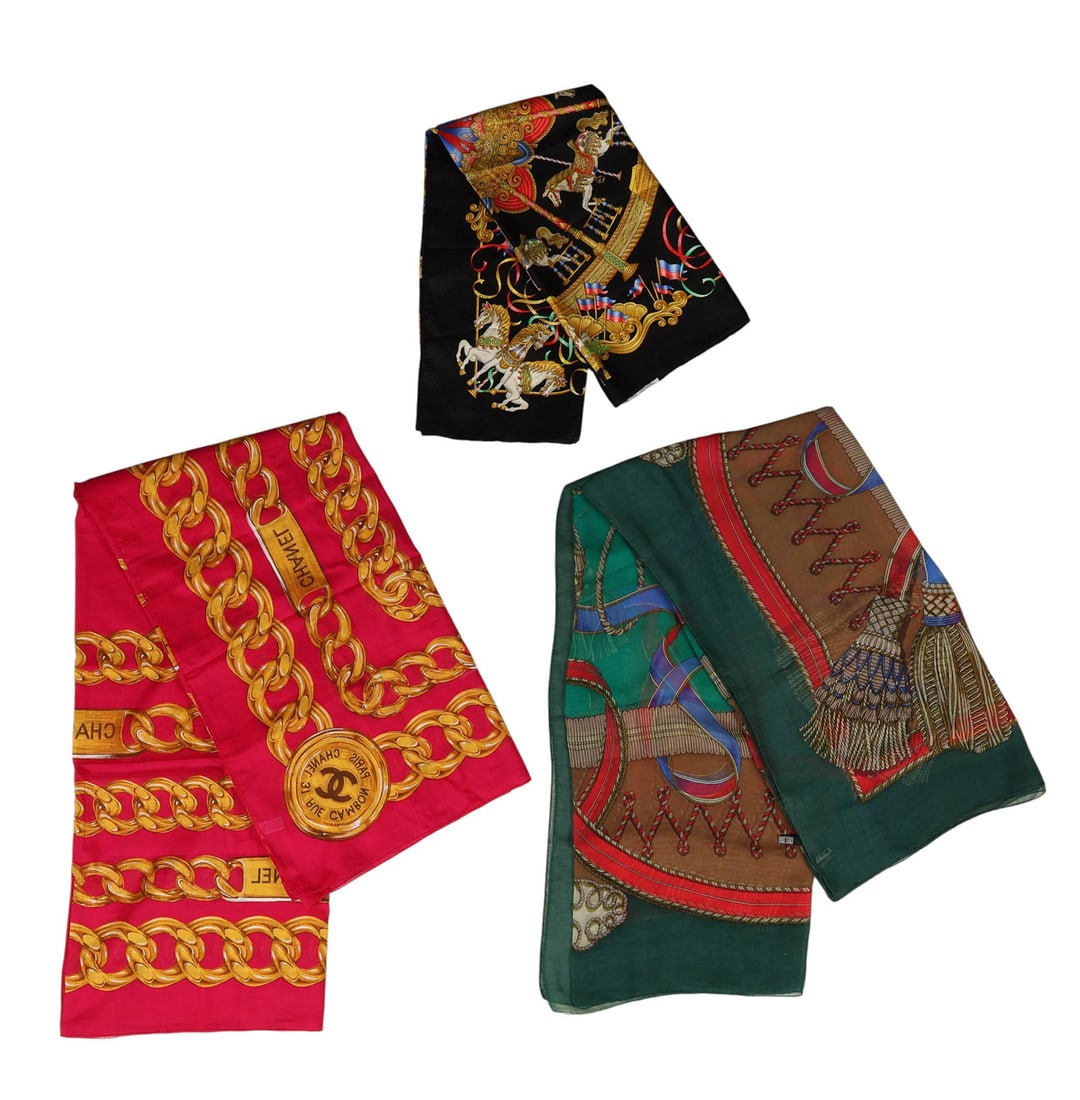 Salvatore Ferragamo Hermes & Chanel Scarves 3p LOT: Three vintage designer scarves, including a Hermes Paris 100% silk scarf measuring approximately 34" x 34", made in France with a carousel-themed motif in gold, red, blue, and black and finished with