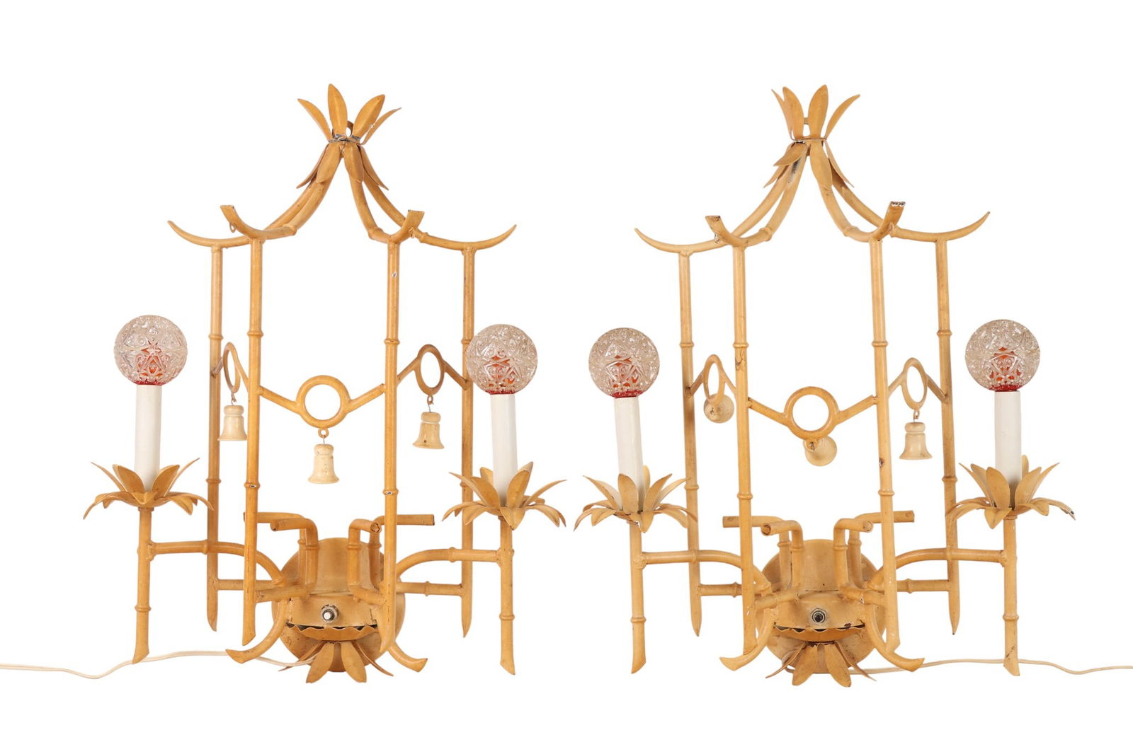 Pair of Faux Bamboo Hollywood Regency Wall Sconces: Pair of vintage wall-mounted sconces in faux bamboo tole metalwork with palm leaf accents, designed in the chinoiserie and Palm Beach Regency style. Each sconce features two arms with candle-style soc