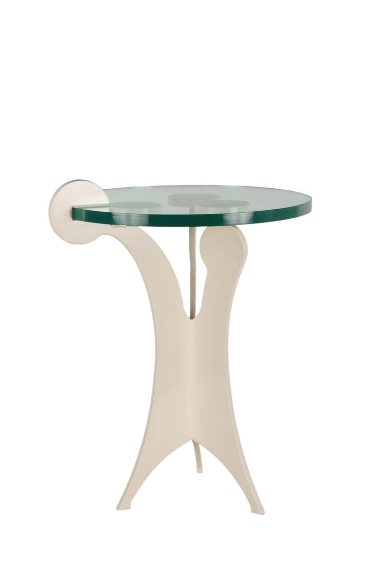 White Enamel Cast Iron Pedestal Table w/ Glass Top: Cast iron white enamel table featuring a sculptural base with three circular supports and an attached arc detail. The clear glass top rests on the three round mounts. No apparent maker's