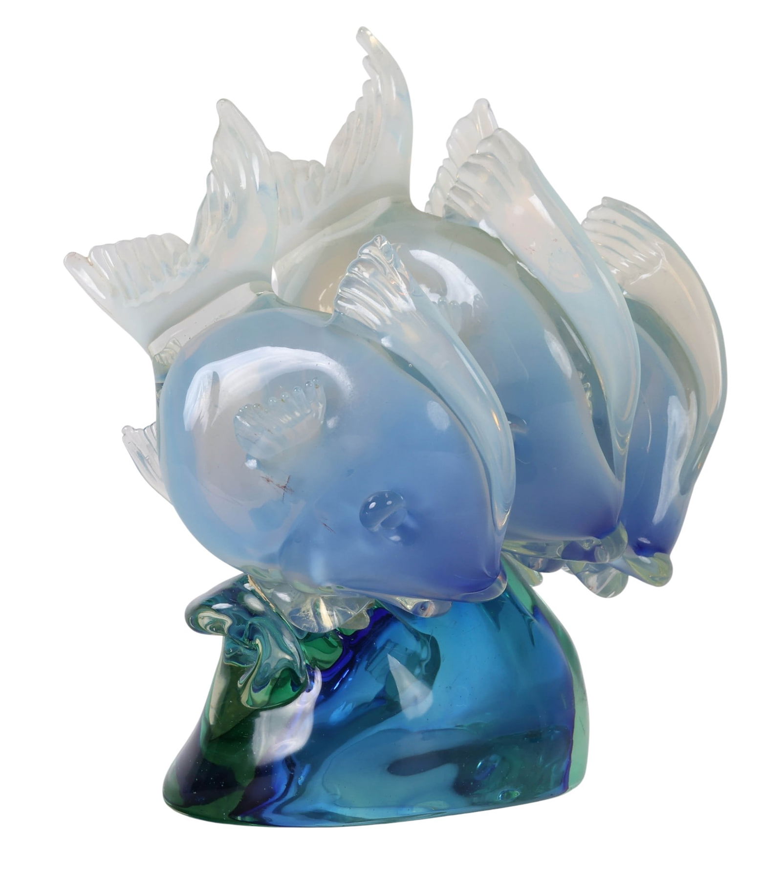 Murano Italy Studio Blown Art Glass Fish Sculpture: Murano Italian hand blown glass sculpture depicting a trio of stylized fish mounted on a solid clear glass base. Each fish features unique fin placements and body contours, crafted in transparent blue
