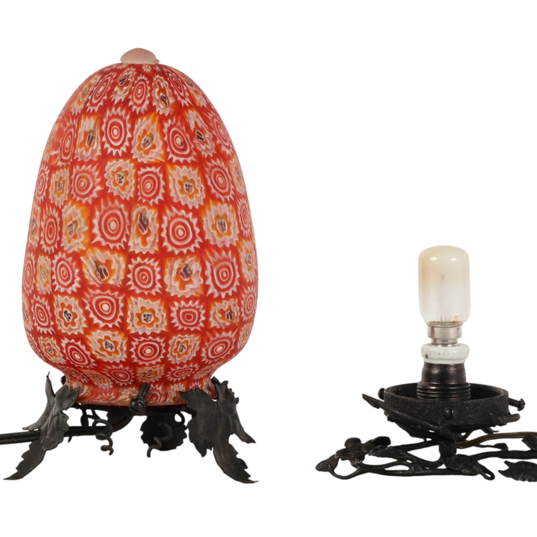 Murano Millefiori Boudoir Glass Lamp w/ Extra Base: Murano Italian style millefiori art glass lamp with vibrant red, orange, yellow, and white cane patterns, mounted on a black wrought iron leaf motif base. Comes with an internal socket and wiring,