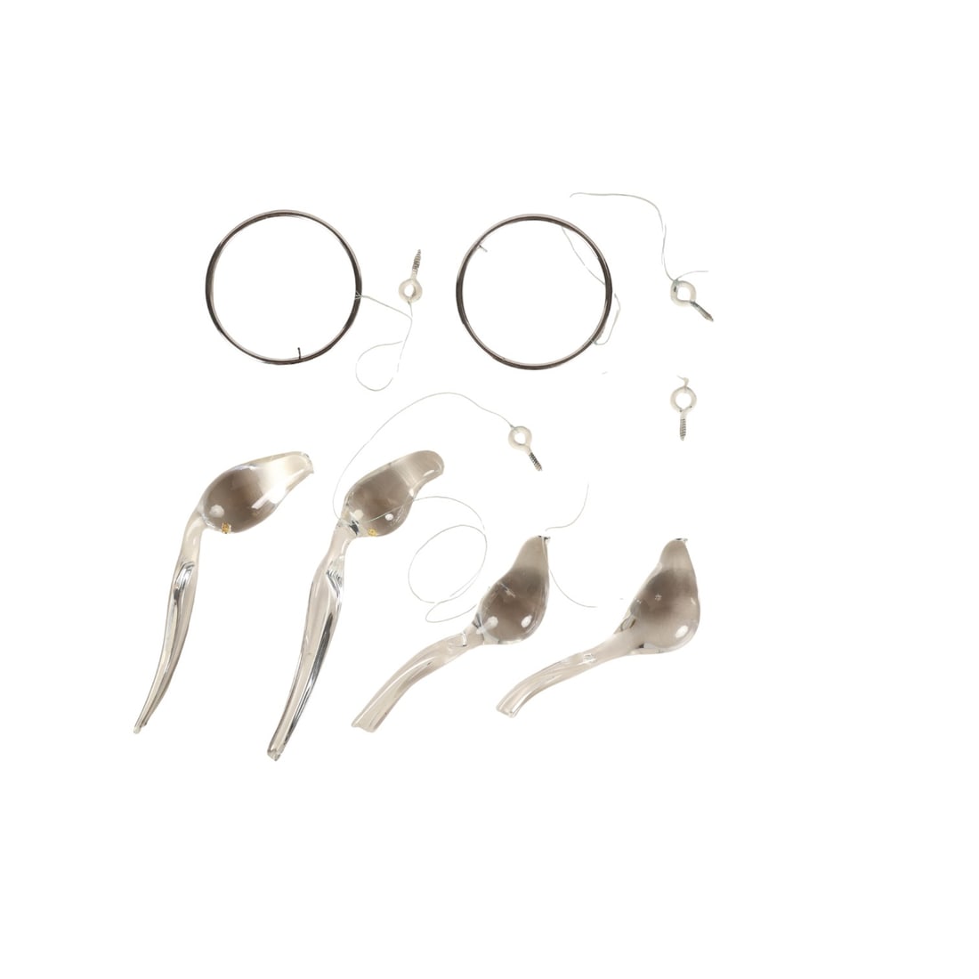 Steuben Bird on Sterling Ring Mobile Sculpture LOT: Designed by Peter Wayne Yenawine (American, born 1944) for Steuben in 1976, a group of four clear crystal bird mobile sculptures, each elegantly formed with smooth contours and elongated tail extensio