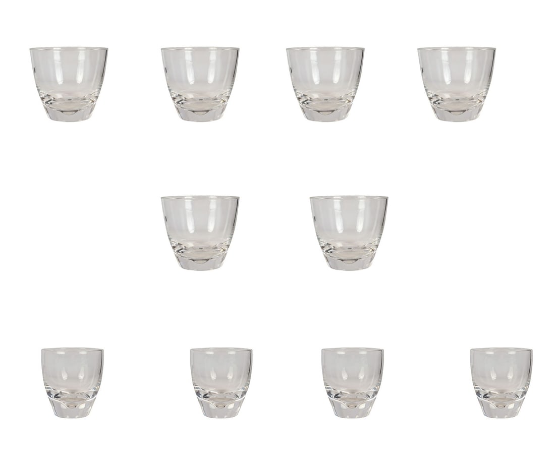 Steuben Crystal Barware Rocks & Shot Glass 10p LOT: Steuben clear crystal barware grouping comprising four cordial or shot glasses and six old fashioned rocks glasses. Each glass features tapering sides and a thick, polished base, showcasing Steuben's