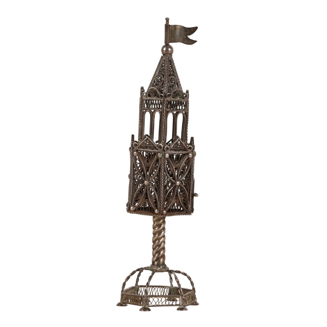 Judaica Silver Filigree Spice Tower Havdalah Box: Intricately crafted silver filigree spice tower, modeled with an architectural form on a twisted stem and hexagonal base. The hinged door opens to a hollow interior compartment, topped with a flag