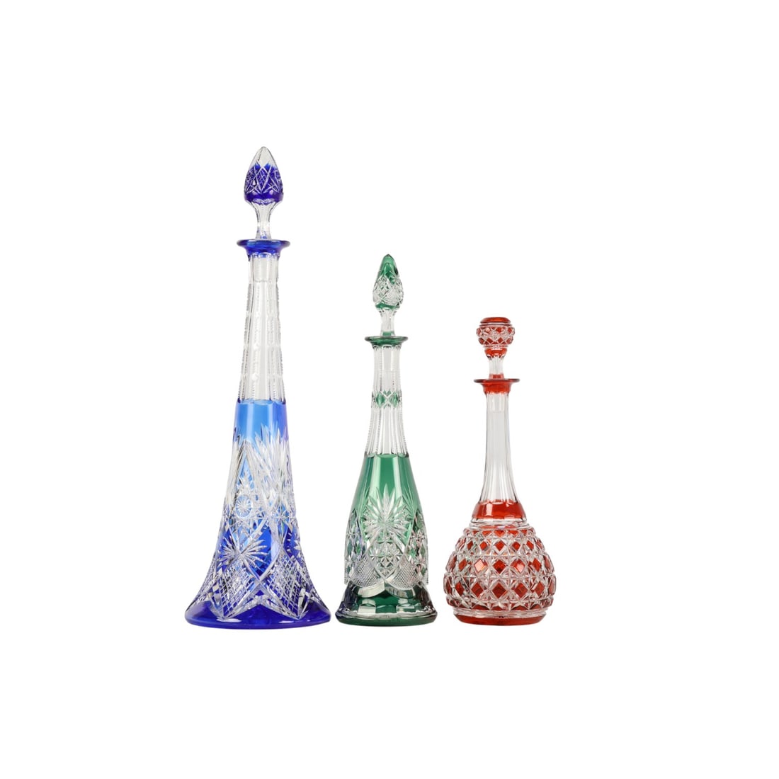 Bohemian Czech Crystal Cut to Clear Decanters LOT: Lot of three Bohemian Czech cut to clear crystal barware decanters with color overlays. Includes one cobalt blue with star and crosshatch pattern, one emerald green with fan and diamond cuts, and one
