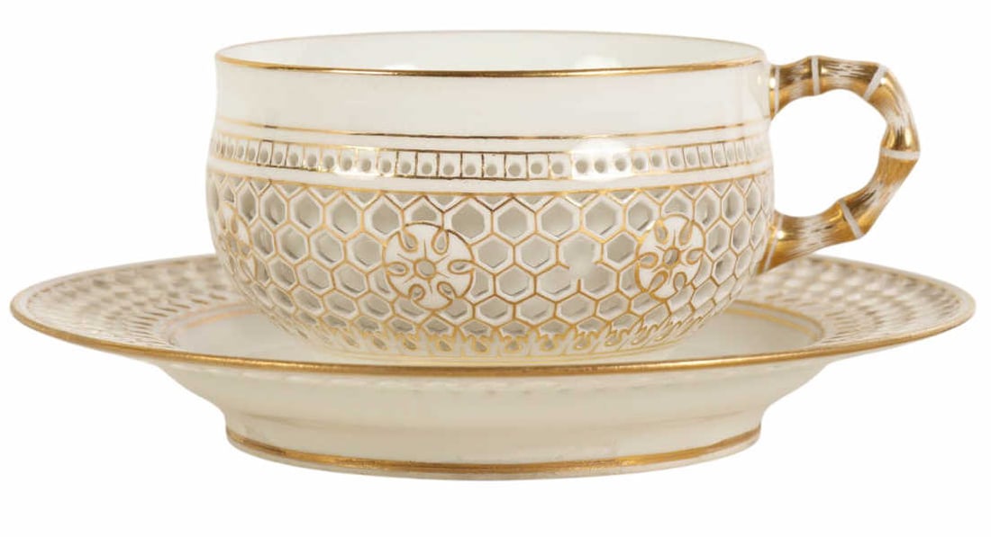 Antique Sevres Porcelain Reticulated Cup & Saucer: Sevres French porcelain teacup and saucer featuring distinctive honeycomb pierced lattice borders with gilt decoration. Both pieces are marked Dore a Sevres with painted date marks for 1889 and 1890,