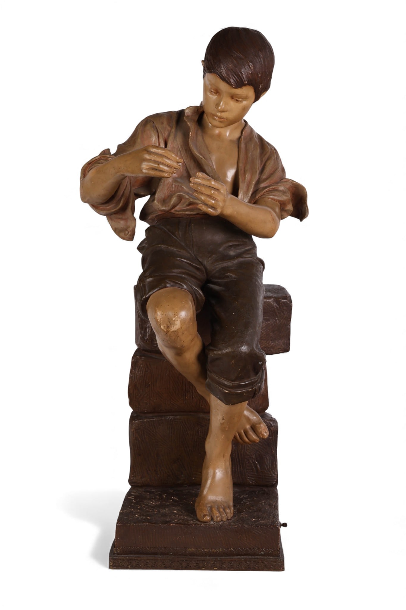 Frederick Goldscheider 1845-1897 Terracotta Boy: Frederick Goldscheider (Austrian, 1845-1897), antique terracotta sculpture depicting a seated boy on a brick wall, finished in neutral-toned glazed polychrome. Previously converted into a lamp,