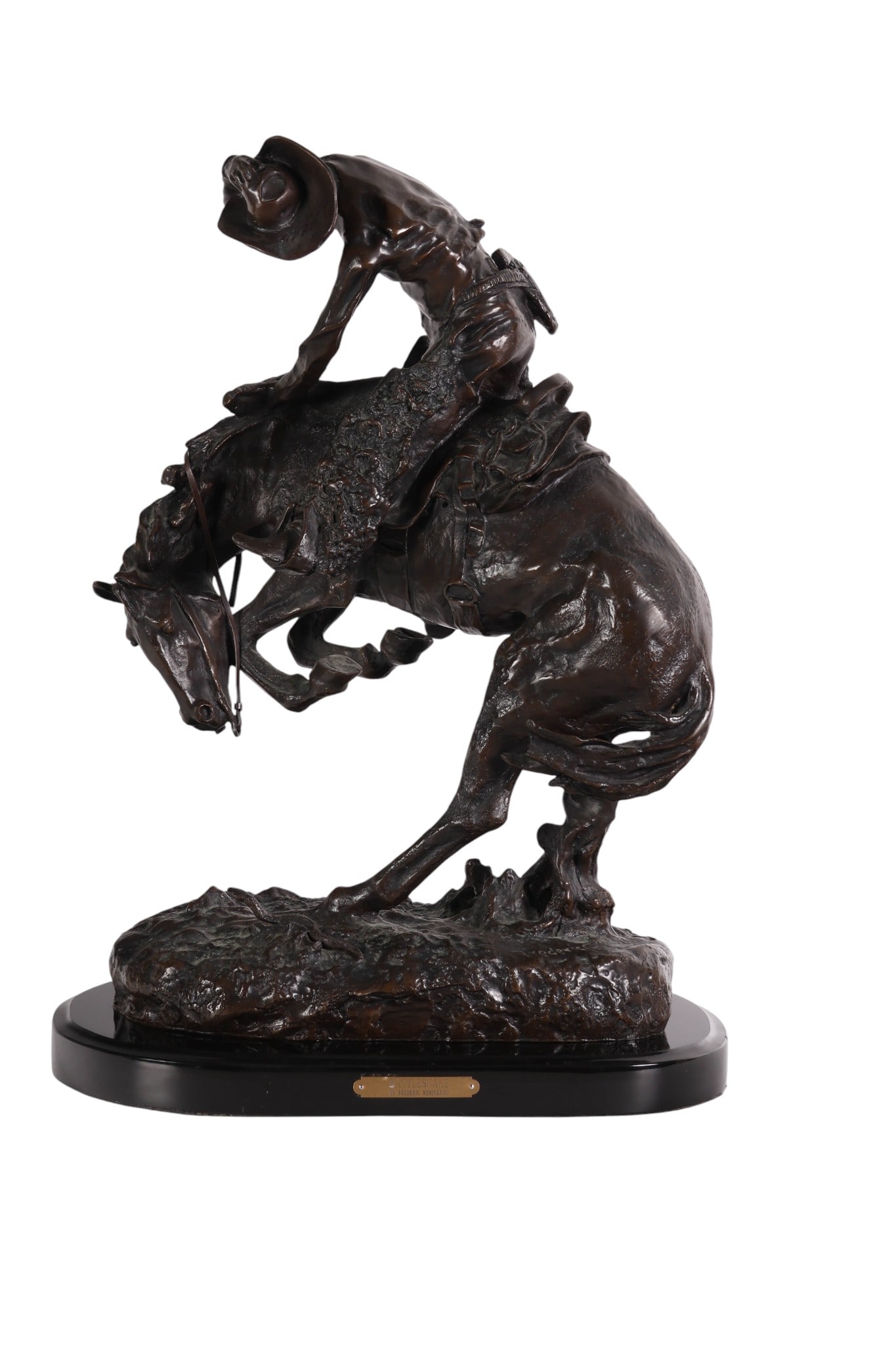The Rattlesnake Bronze Sculpture After F Remington: A cast bronze Western Cowboy sculpture titled The Rattlesnake after the original work by Frederic Sackrider Remington (American, 1861-1909). The figural group captures a cowboy astride a rearing