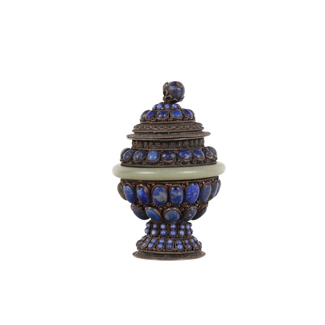 Chinese Jade & Lapis Jeweled Silver Lidded Vessel: Chinese Tibetan ceremonial style lidded silver vessel of baluster form, mounted with numerous cabochon lapis lazuli blue stones set in ornate filigree-style bezels. The body features a central jade ri