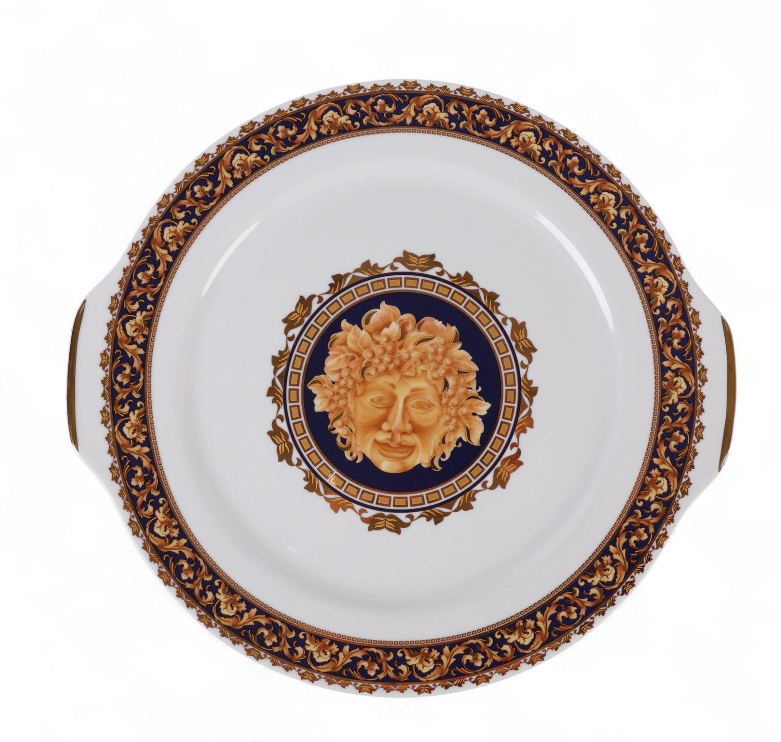 Limoges France Bacchus Porcelain Cake Pie Plate: Limoges French porcelain double tab handle cake plate featuring a central image mask face of Bacchus, the Roman God of wine, surrounded by a cobalt blue and rich gold gilt scrollwork border decorated