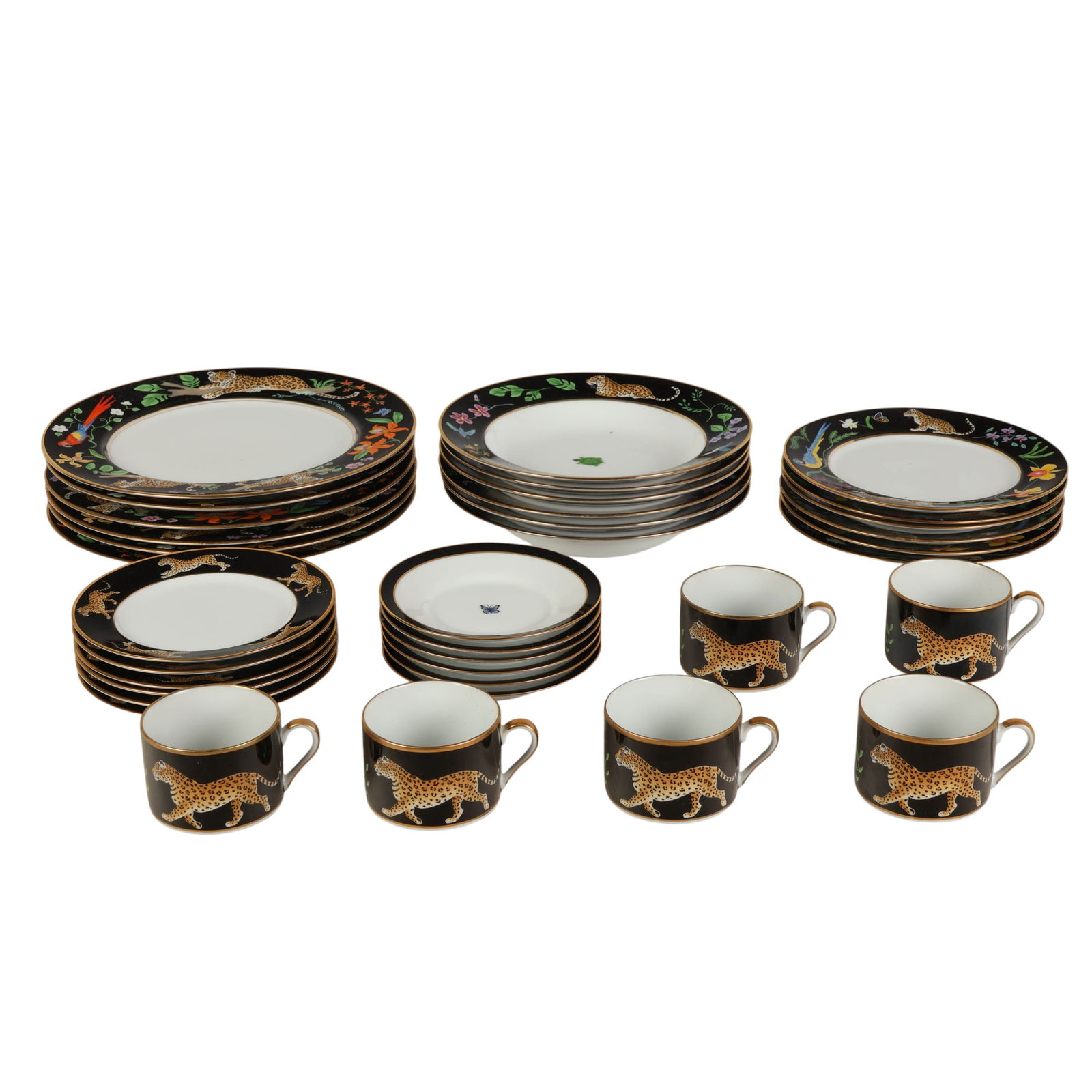 Lynn Chase 36 Piece Jaguar Jungle Dinnerware SET: 36-piece porcelain tableware service for six by Lynn Chase in the Jaguar Jungle pattern, featuring black and gilt borders with colorful parrots, foliage, florals, and wild cats in varied poses. The se