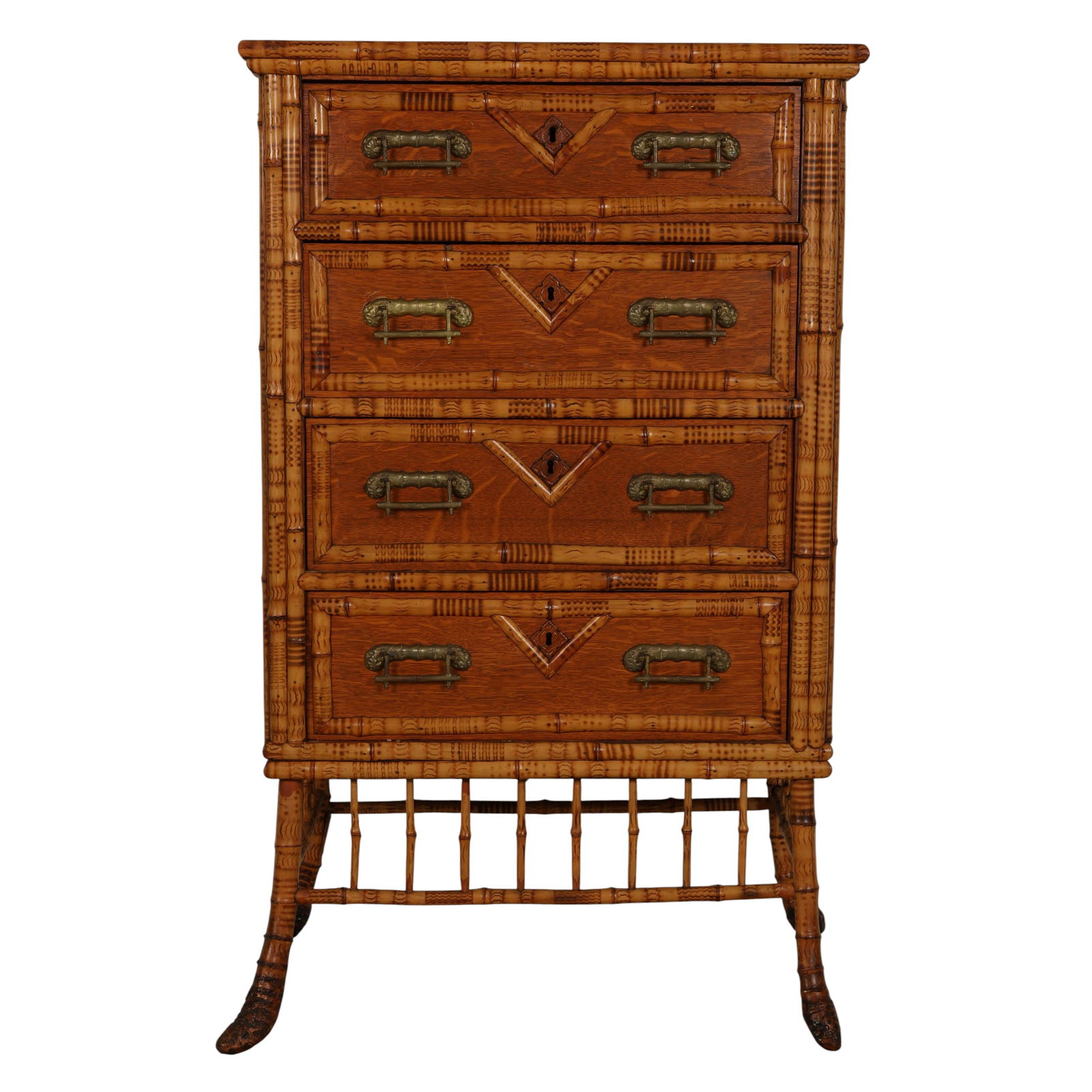 Antique Brighton Style Bamboo Chest of Drawers: Antique English Brighton style bamboo chest of drawers featuring four graduated drawers with brass handles. The piece is framed with faux bamboo supports, shaped legs, and a spindle gallery stretcher