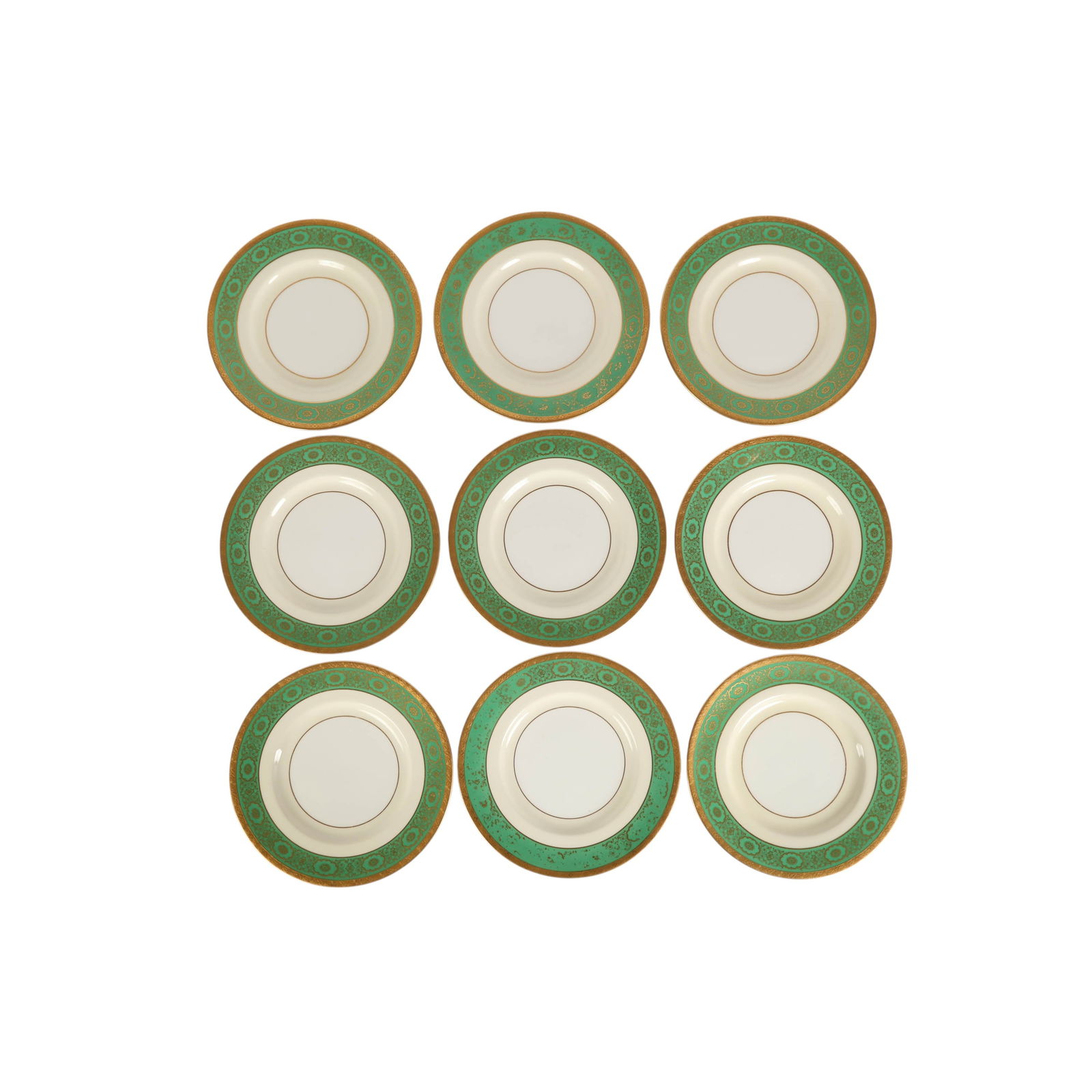 Tiffany & Co Minton Porcelain Luncheon Plates SET: Set of nine decorative porcelain plates by Minton for Tiffany & Co New York, each featuring a wide emerald green border richly embellished with gilt floral and foliate motifs. The design is framed by