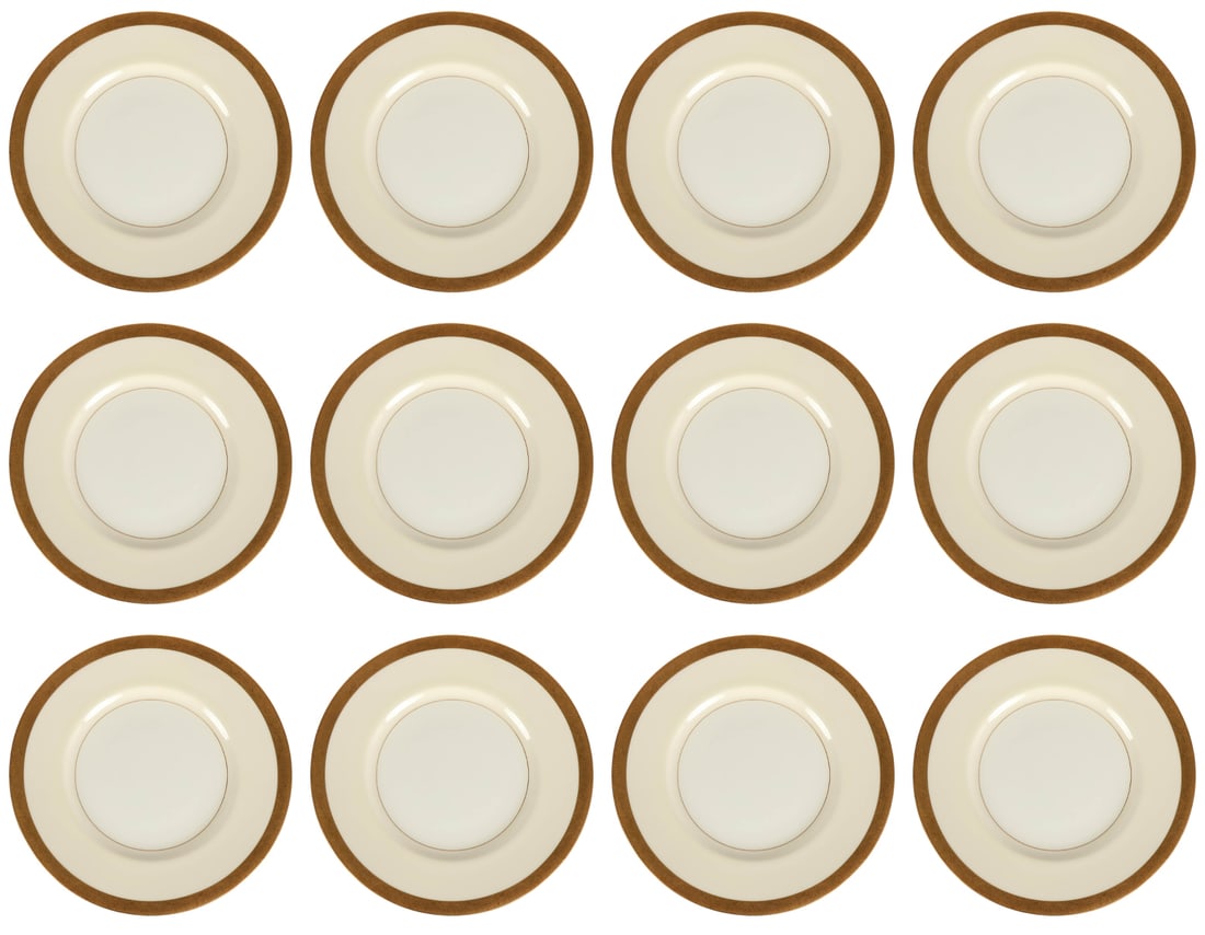 Tiffany & Co Minton Gold Gilt Dinner Plate 12p SET: Tiffany & Co New York, a set of twelve porcelain dinner plates produced by Minton of England. Each plate features a wide cream-white well framed by an elaborate gilt border finely engraved with