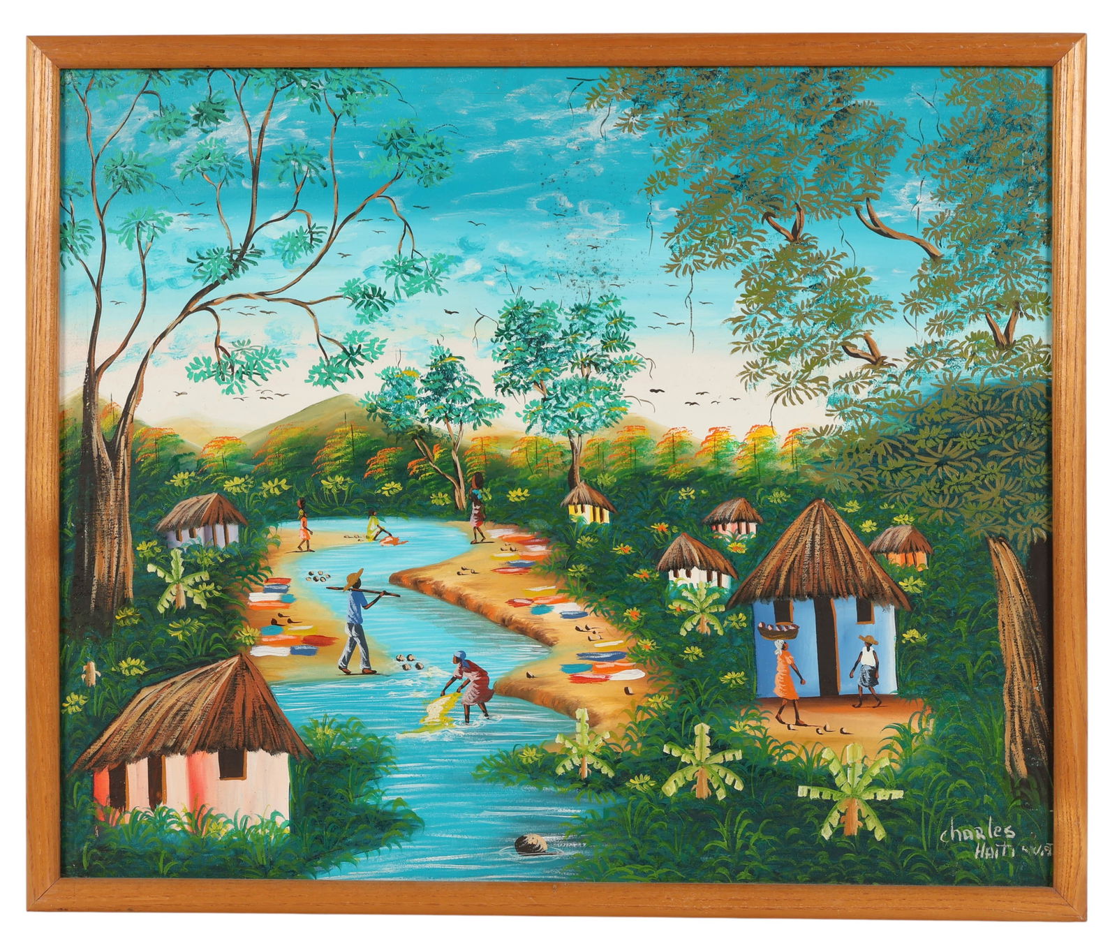 Charles 20C Haitian Figural Landscape Oil Painting: Charles (Haiti, 20th century), oil painting on canvas depicting a village scene with figures by a river surrounded by huts, trees, and mountains. Signed lower right, with hand-inscribed artist name on