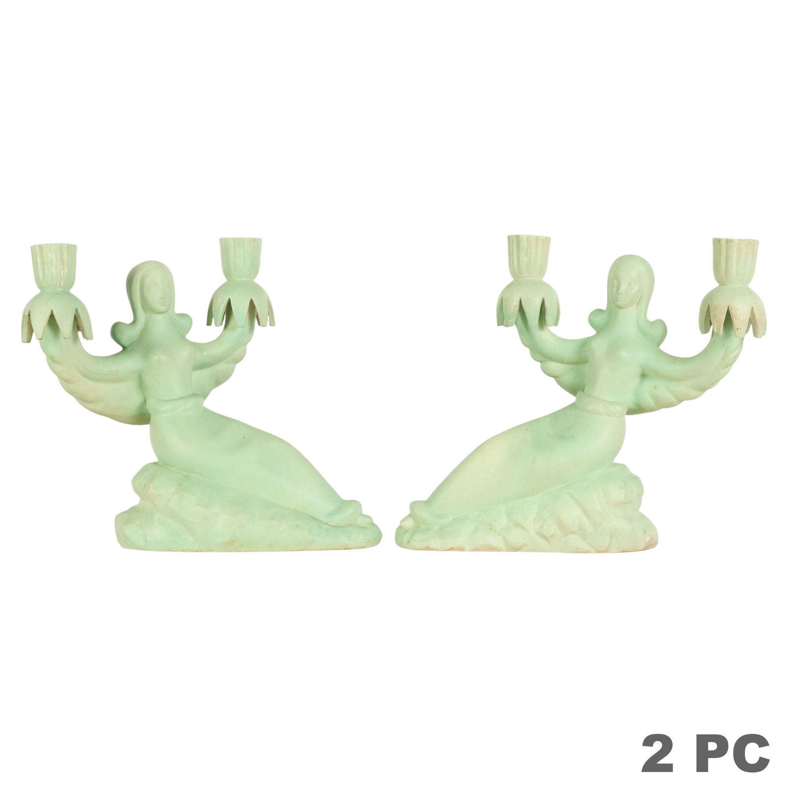 Pair of Art Nouveau Figural Pottery Candleholders: Pair of Art Deco matte green art pottery candle holders, each modeled as a stylized female figure with arms outstretched, holding two candle cups. Sculptural and symmetrical in form, embodying the str