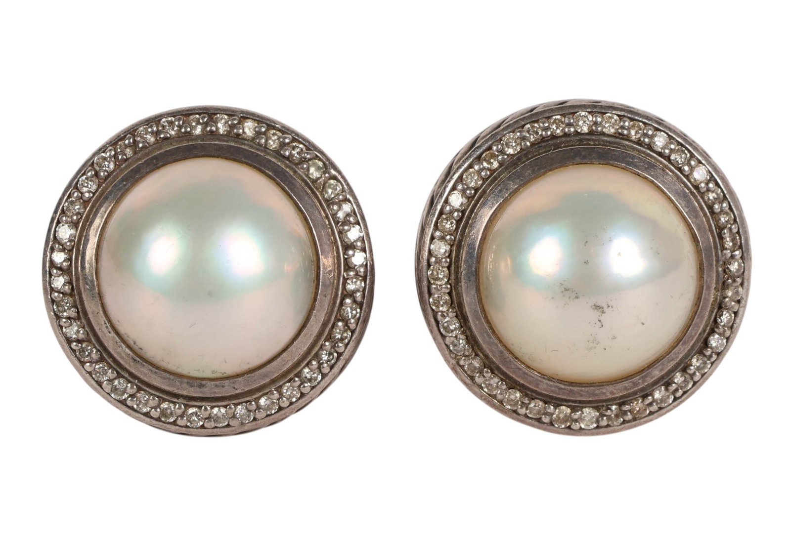 David Yurman Sterling Silver Mabe Pearl Earrings: David Yurman sterling silver mabe pearl and diamond accent earrings featuring large mabe pearls surrounded by a halo of small diamonds within a classic cable motif border. Each earring measures approx