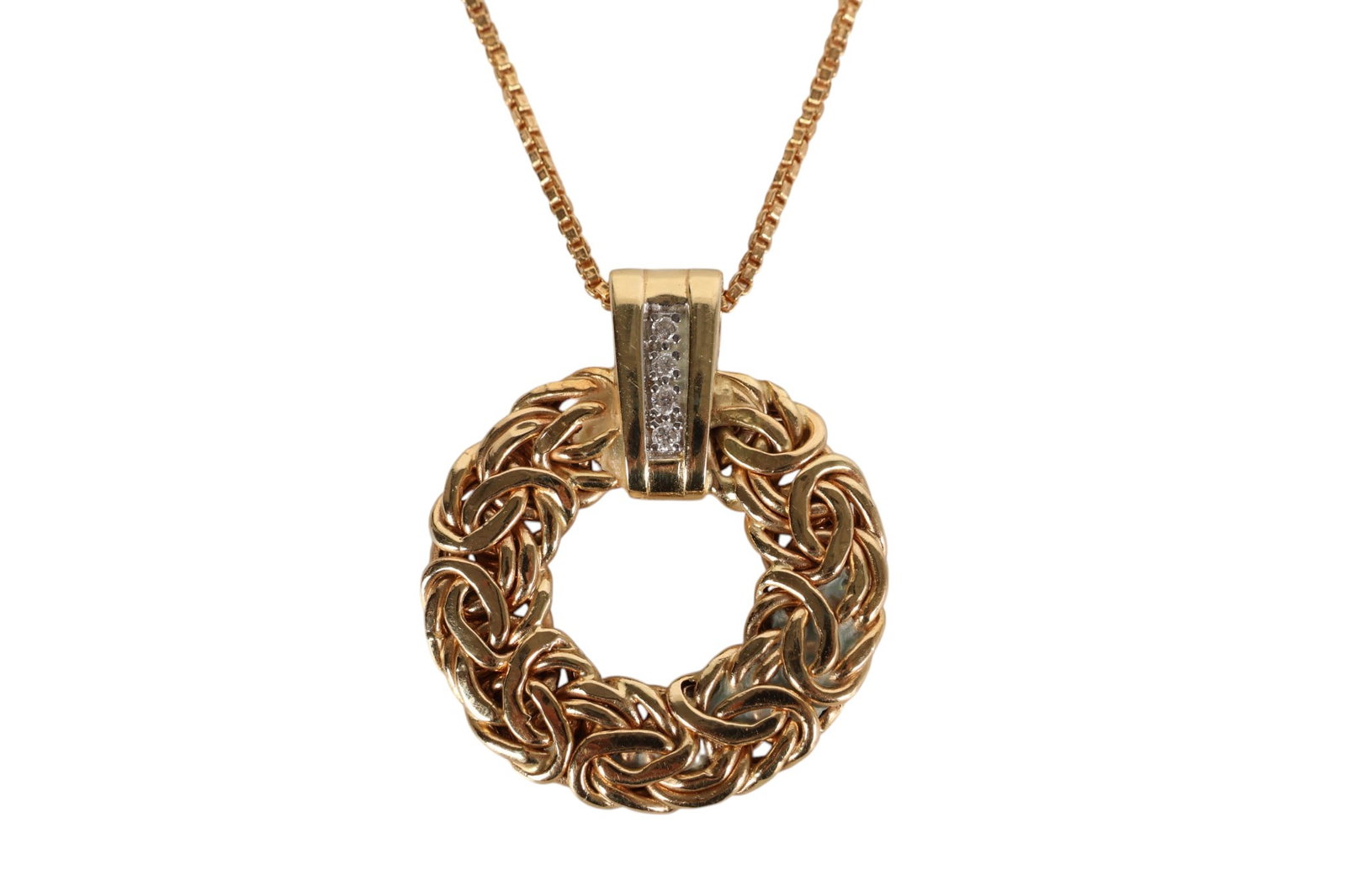 14K Yellow Gold Turkish Diamond Pendant & Chain 8g: 14K yellow gold Turkish round pendant set with four accent diamonds, designed in a wreath motif and measuring approximately 1 inch in diameter. Suspended from an Italian 14K gold box link chain measur