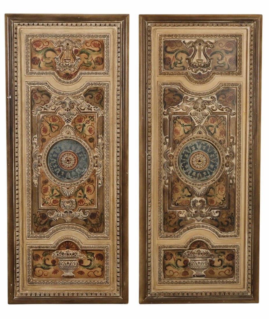 Antique Style Ornate Pair of Mirrored Wall Panels: Pair of decorative composition and wood wall panels featuring ornate molded frames with classical scrollwork and relief detailing surrounding hand-painted style foliate and floral motifs. Each panel