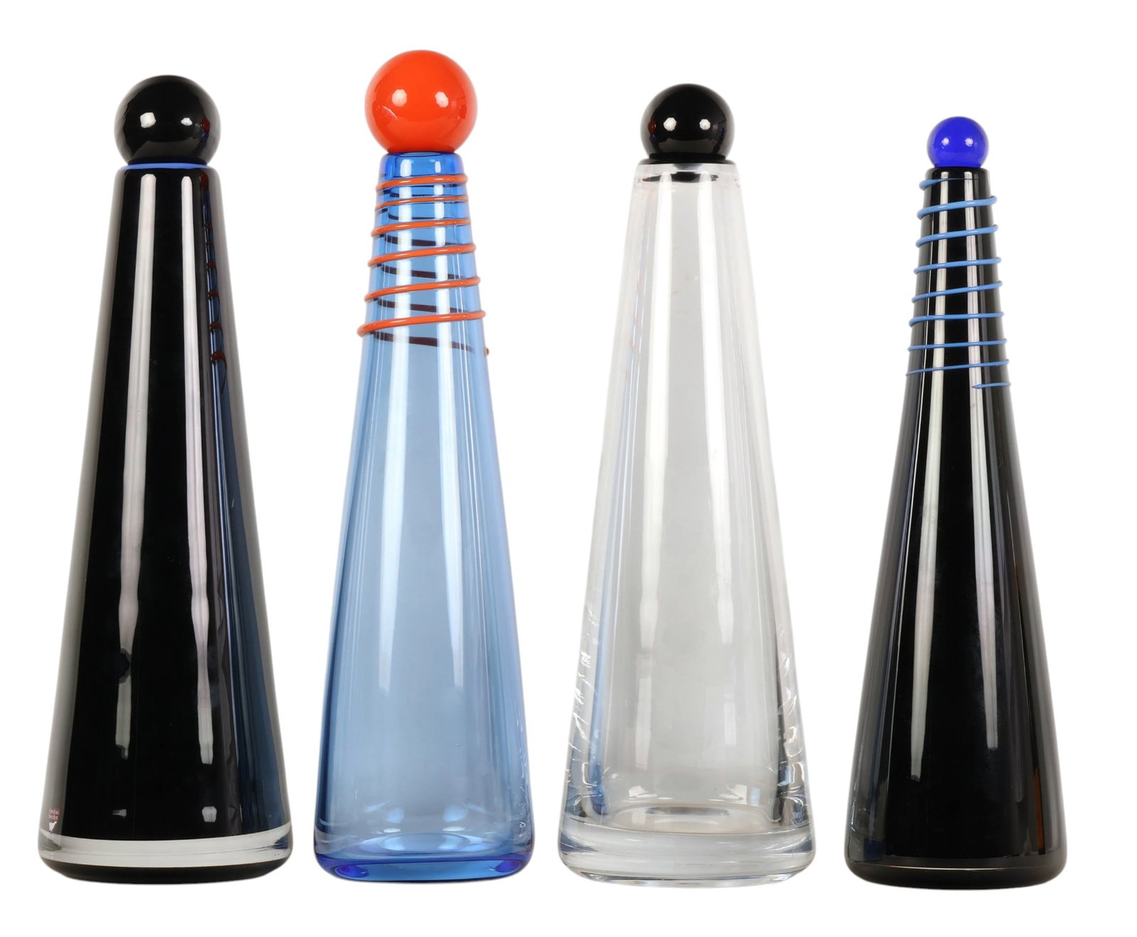 Orrefors Fredrik Nielsen Glass Decanters 4pc. LOT: Lot of four modern studio art glass decanters designed by Fredrik Nielsen (Swedish born, 1977), for Orrefors, each featuring a tapered conical form fitted with a glass spherical ball shaped stopper.