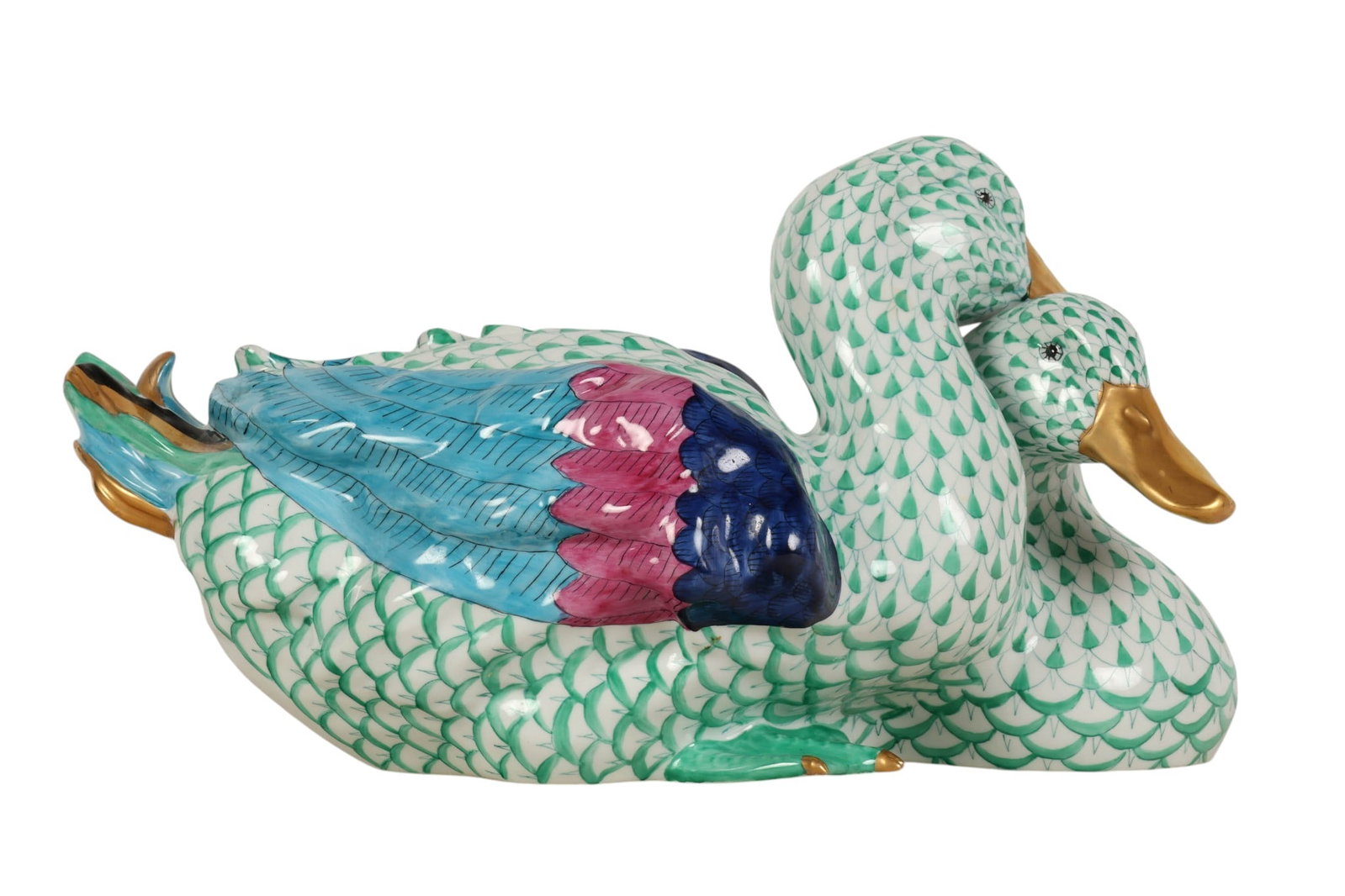 Herend Hungarian Green Ducks Porcelain Figurine: Herend Hungarian hand painted porcelain double duck figurine in the classic green fishnet pattern, featuring a pair of resting ducks with finely detailed plumage. The bodies are decorated with the sig