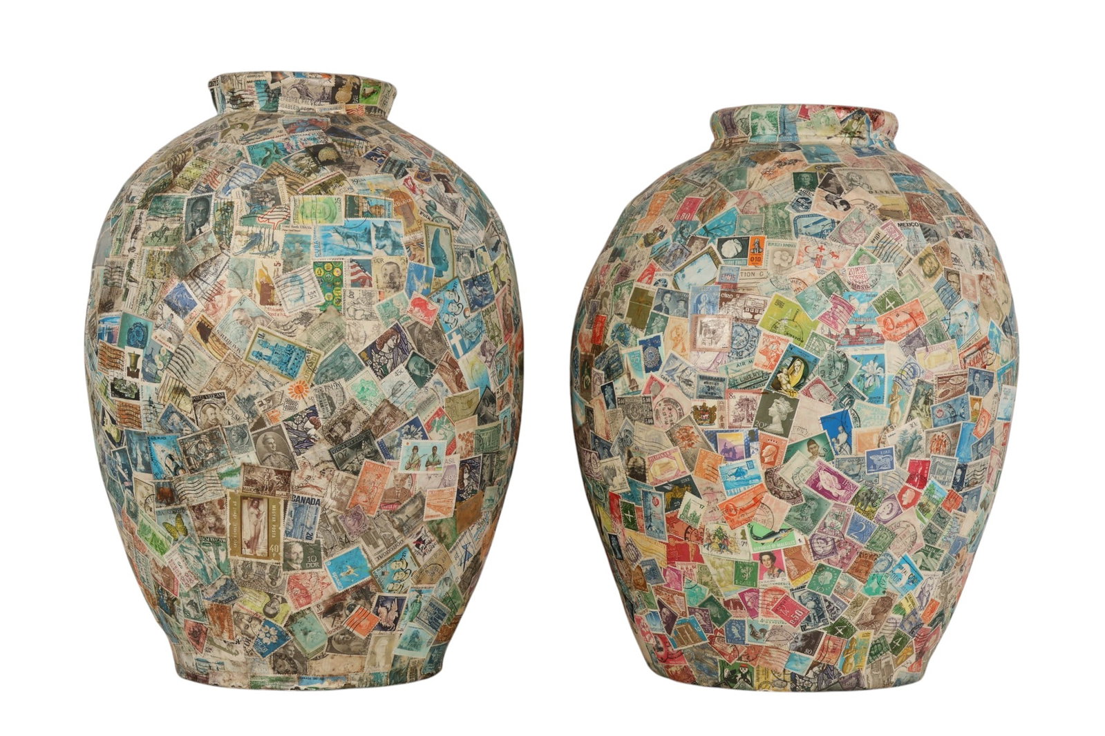 Decoupage 1970s Mid Century Pair Travel Stamp Pots: Decoupage 1970s mid century modern era pair terracotta vessels. Each ovoid pot is covered in a myriad of postage stamps from around the world. Colorful planters bear the MAIA Collection label on botto