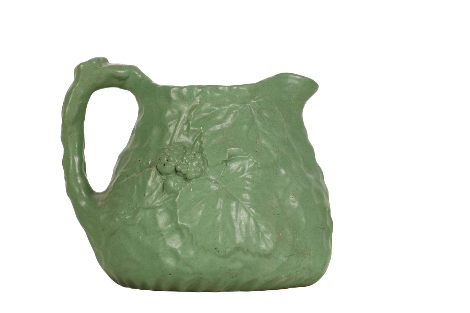 Cambridge Art & Crafts Pottery Green Glaze Pitcher: Early 20th century Cambridge Art Pottery molded pitcher featuring a rich matte green glaze and an organic, naturalistic form with raised berry cluster and foliate decoration. The body is sculpted in a