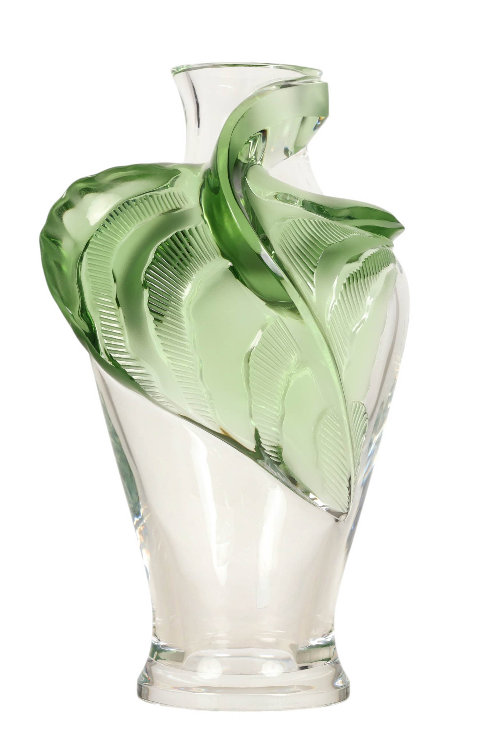 Lalique French Crystal Sculpted Green Tanega Vase: Lalique France "Tanega" sculptural clear and green crystal vase featuring a gracefully curved form adorned with applied frosted green leaf motifs wrapping along one side. The leaves display finely mol