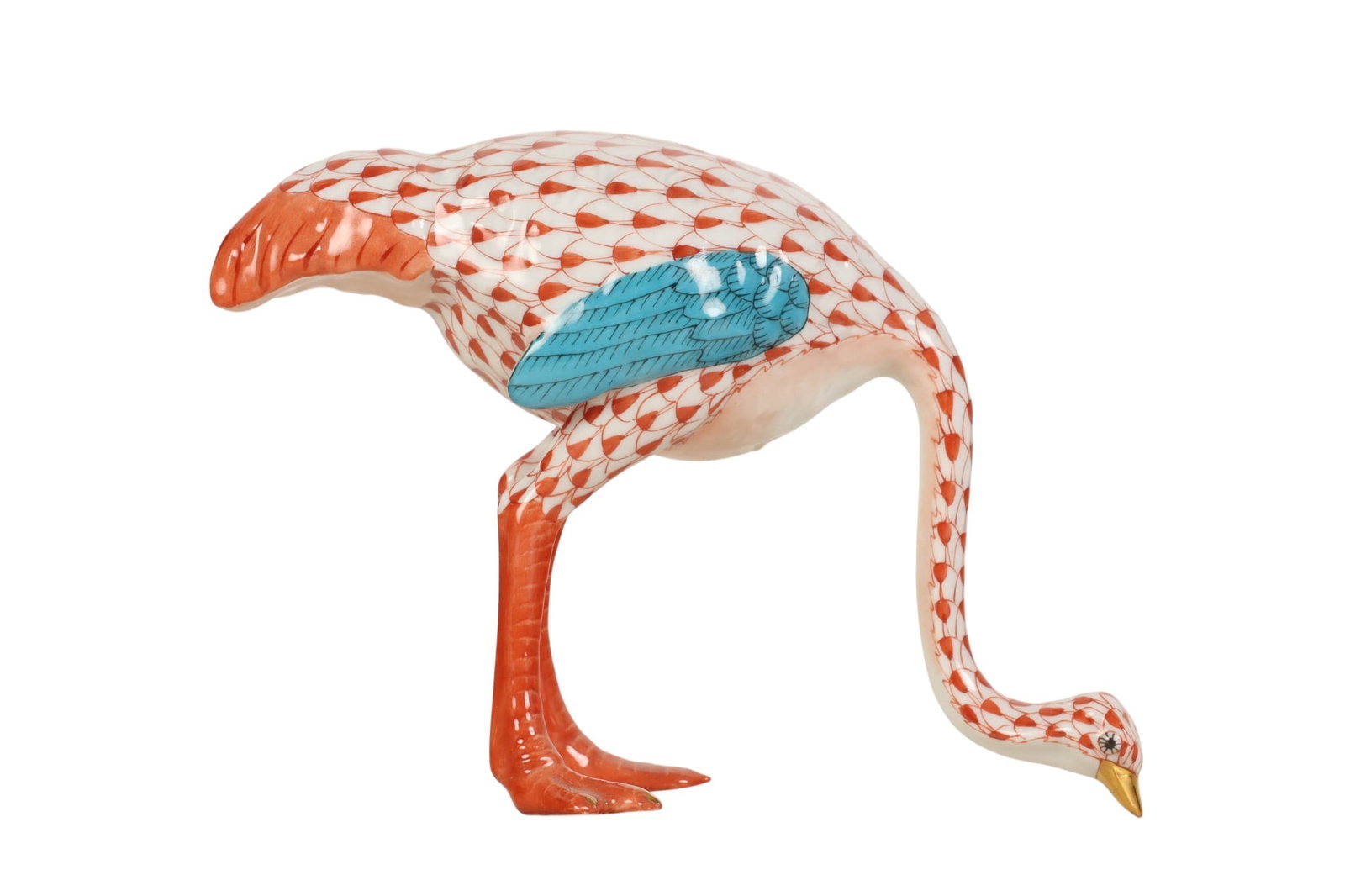 Herend Rust Fishnet Porcelain Ostrich Bird Figure: Herend Hungary hand-painted porcelain ostrich figurine. Features the companys signature fish scale decoration in the Rust Fishnet pattern. Depicts a large flightless bird foraging on the ground, with 