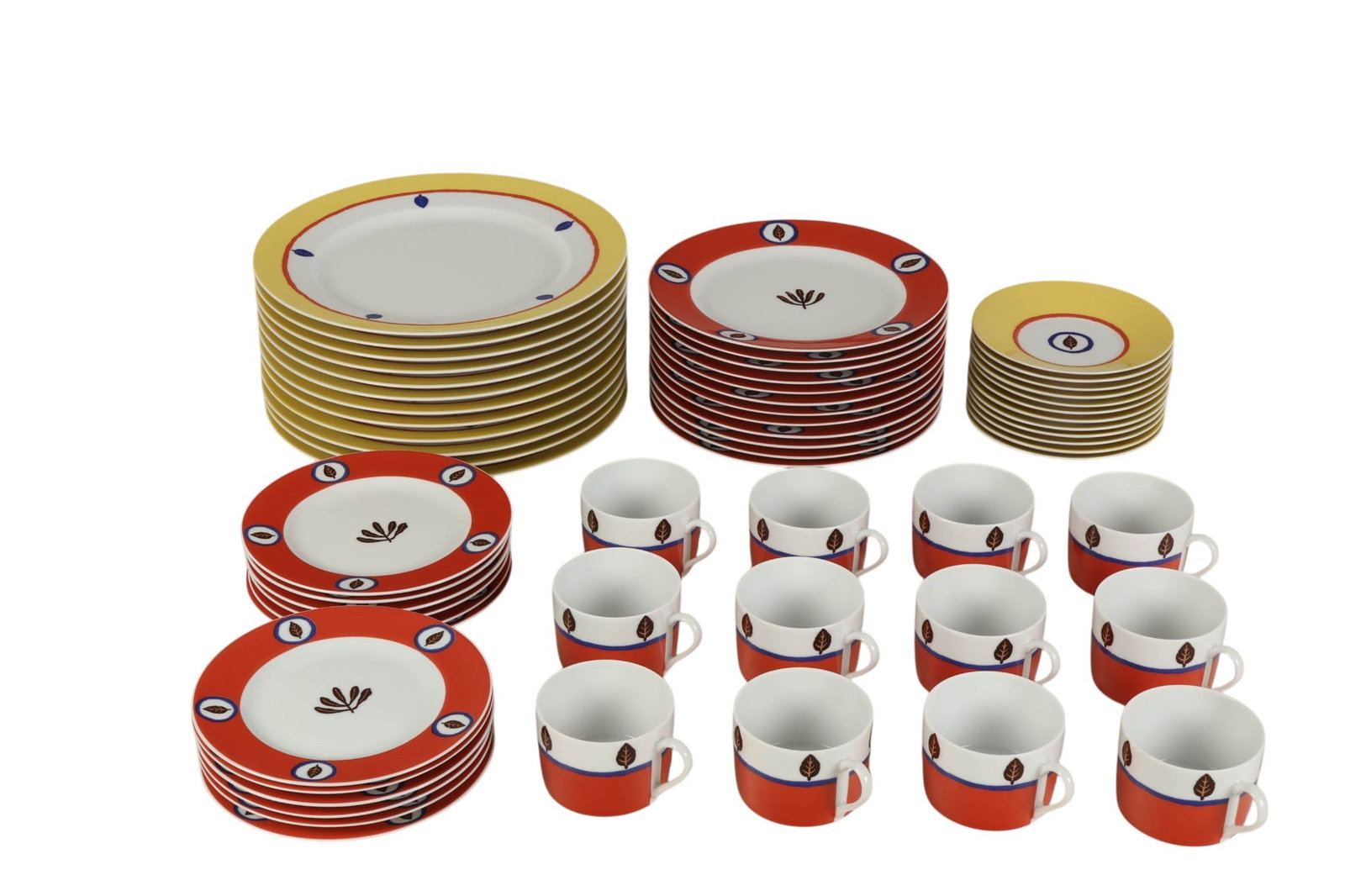 Bernardaud Limoges ALSTER Service for Twelve SET: 60 piece set of Bernardaud Limoges porcelain dinnerware service for twelve in the Alster 1993 pattern, featuring vibrant yellow and coral borders accented with stylized blue and brown leaf motifs. The