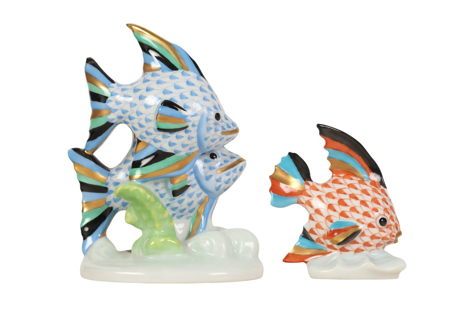 Herend Blue & Rust Fishnet Porcelain Fish Figurine: Herend Hungary hand-painted porcelain tropical coral reef fish figurines, two-piece lot. Each features the companys signature fish scale decoration, one in the Blue Fishnet pattern and the other in th