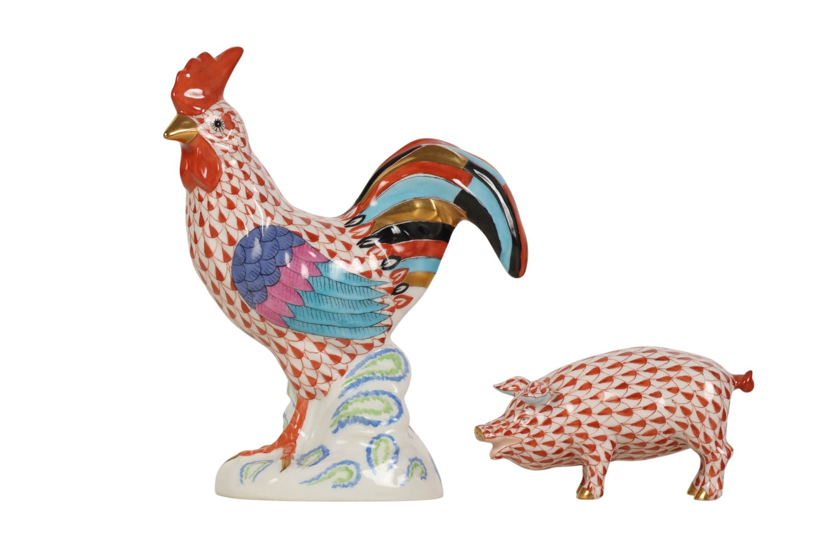 Herend Pig & Rooster Rust Fishnet Porcelain Figure: Herend Hungary hand painted porcelain figurines, lot of two. Both feature the company's signature fish scale decoration in Rust Fishnet pattern. The wings and tail of the cock bird with a polychrome p