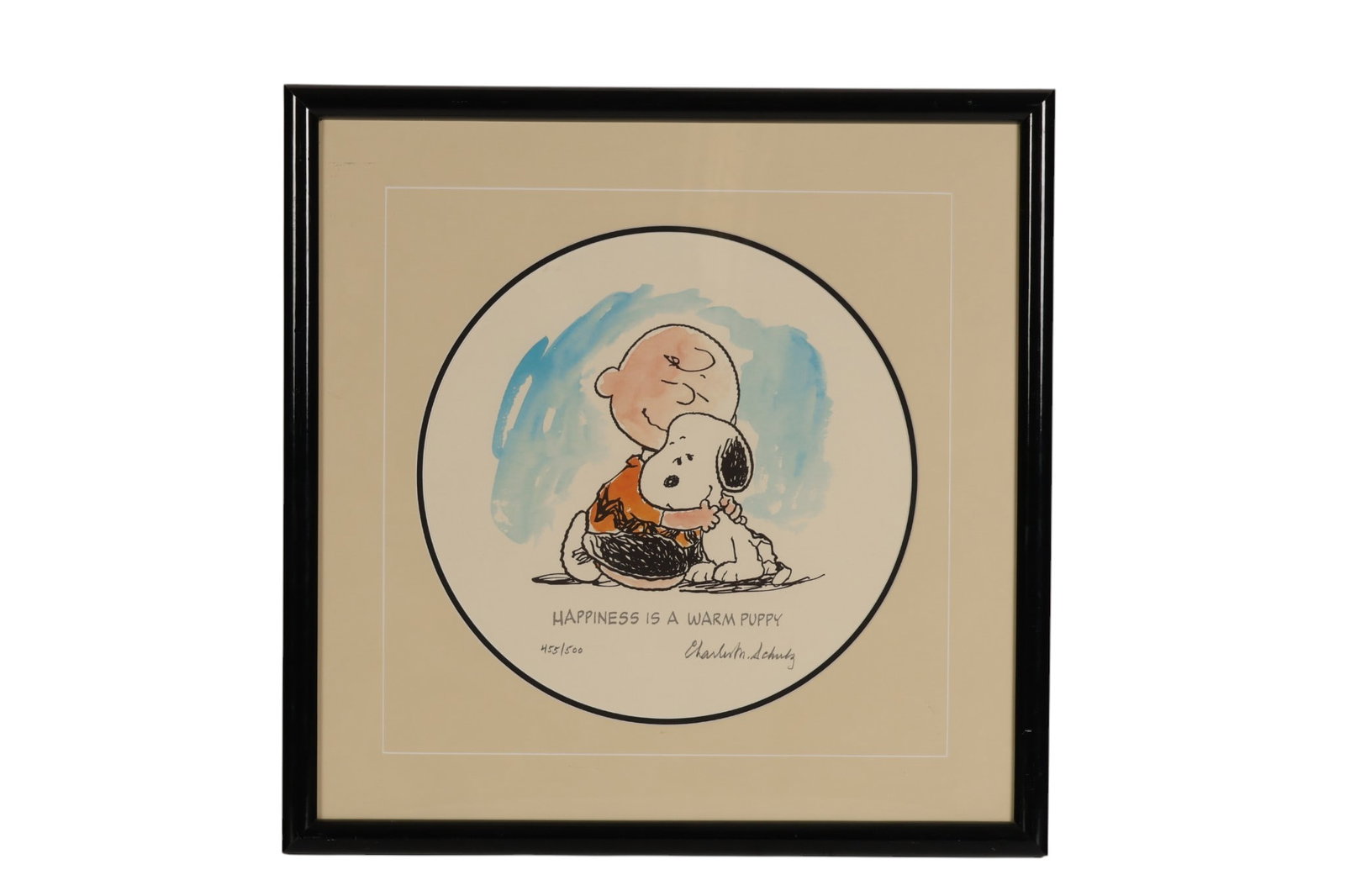 Charles Schulz Limited Edition Lithograph SIGNED: Charles M. Schulz (American, 1922-2000), "Happiness is a Warm Puppy" colored lithograph on paper depicting Charlie Brown embracing Snoopy within a circular composition. The charming image reflects the