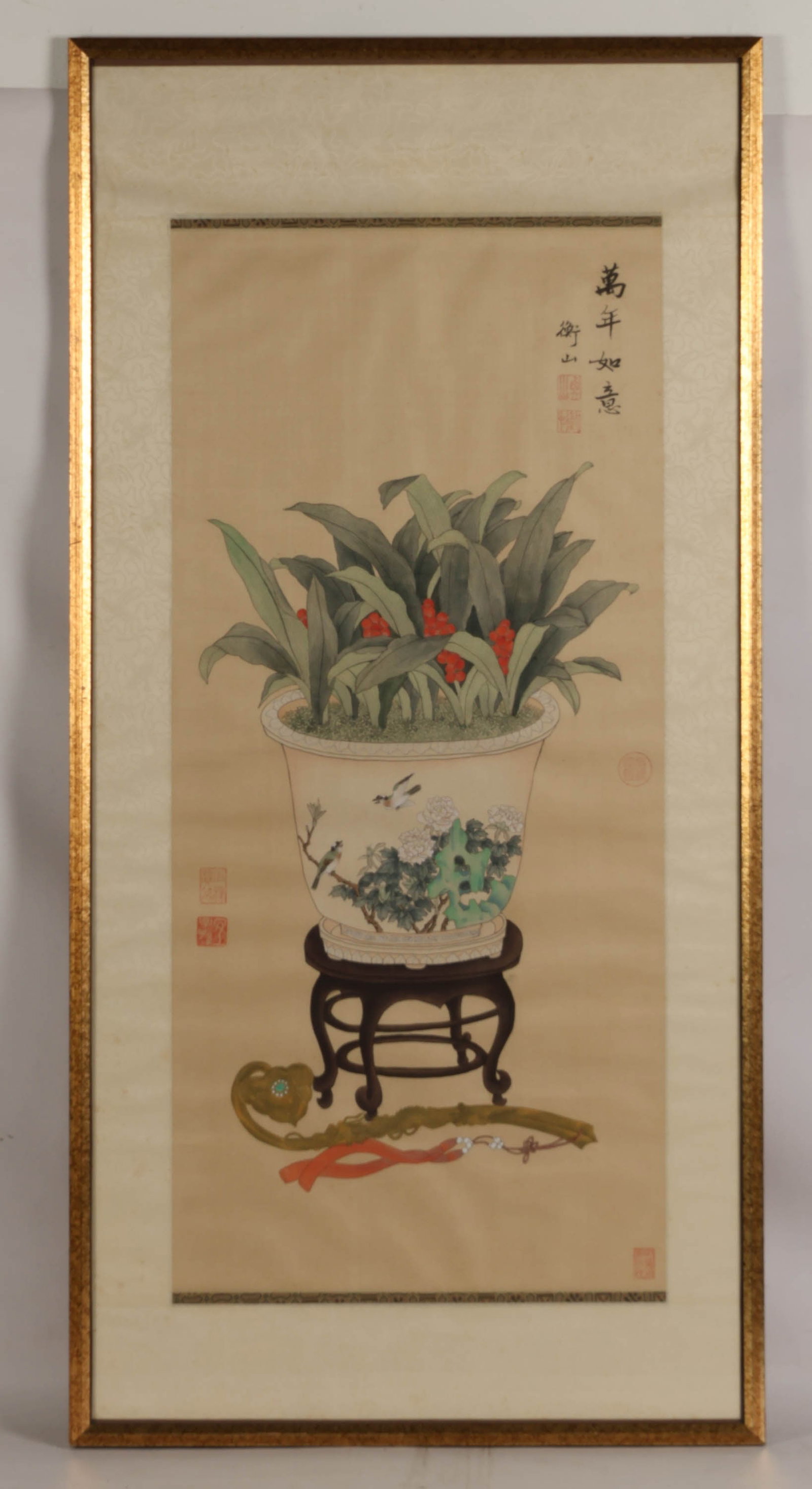 Chinese Still Life Gauche Painting on Silk SIGNED: Chinese gouache painting on silk depicting a potted arrangement of green foliage with clusters of red berries presented in a decorative jardiniere adorned with birds and floral motifs. The vessel rest
