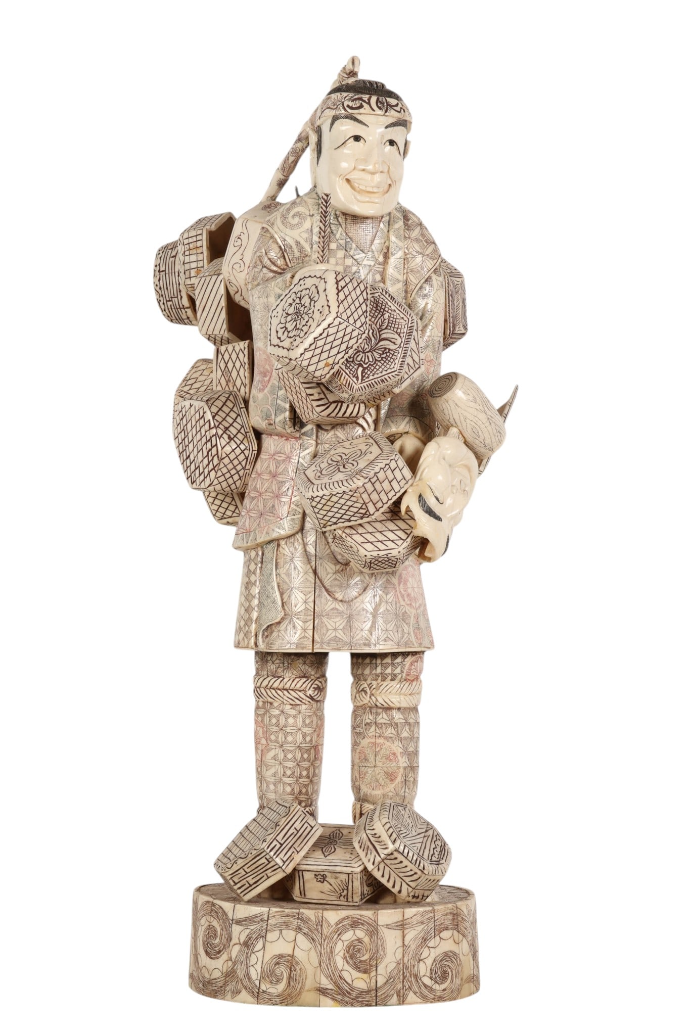 Japanese Meiji Carved Okimono Merchant Sculpture: Japanese Meiji Period hand carved bone decorative okimono depicting a cheerful traveling merchant laden with bundled wares upon his back. The finely detailed surface is adorned with incised geometric 